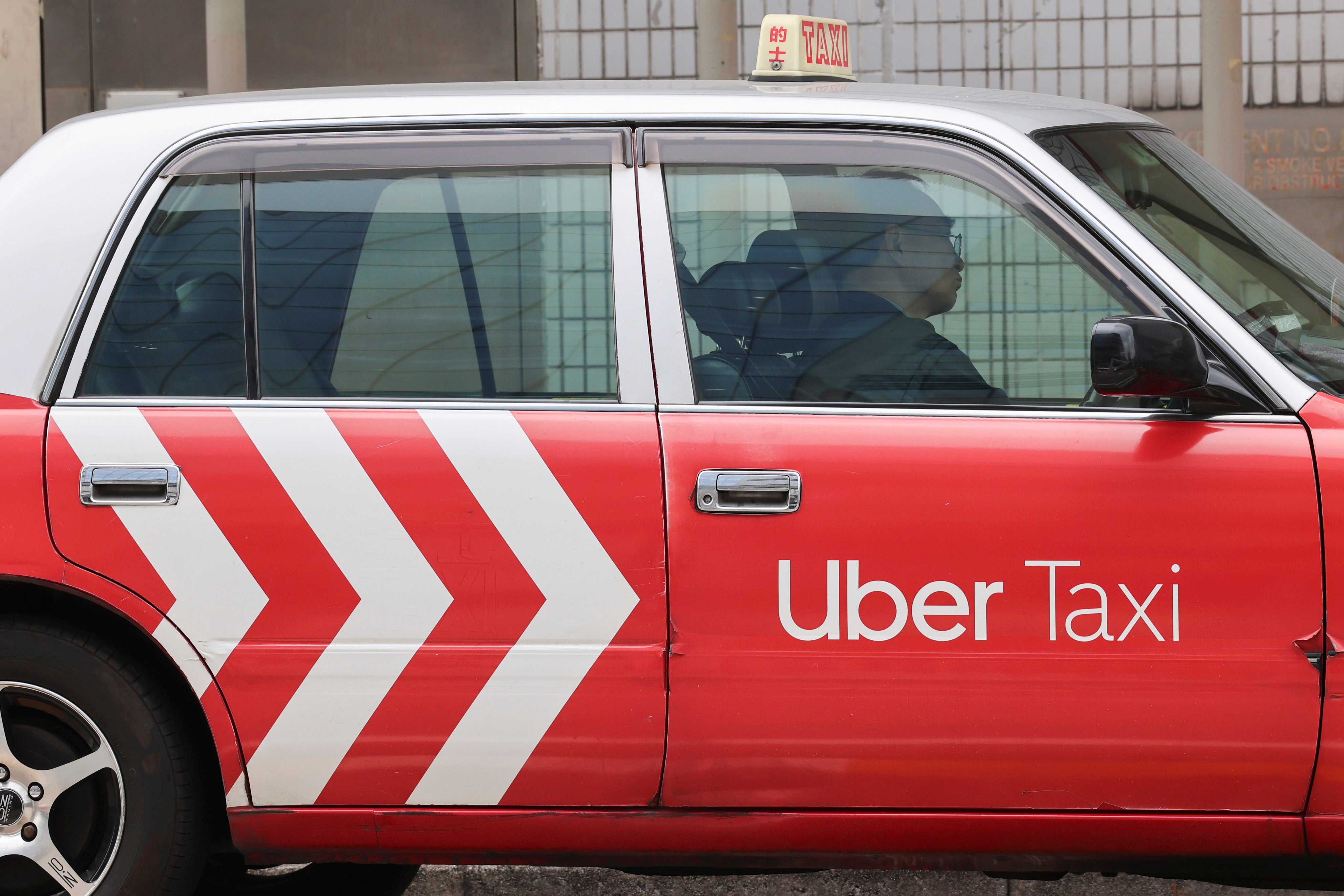 An Uber taxi waits at stand outside Kowloon Tong MTR station. Photo: Jelly Tse
