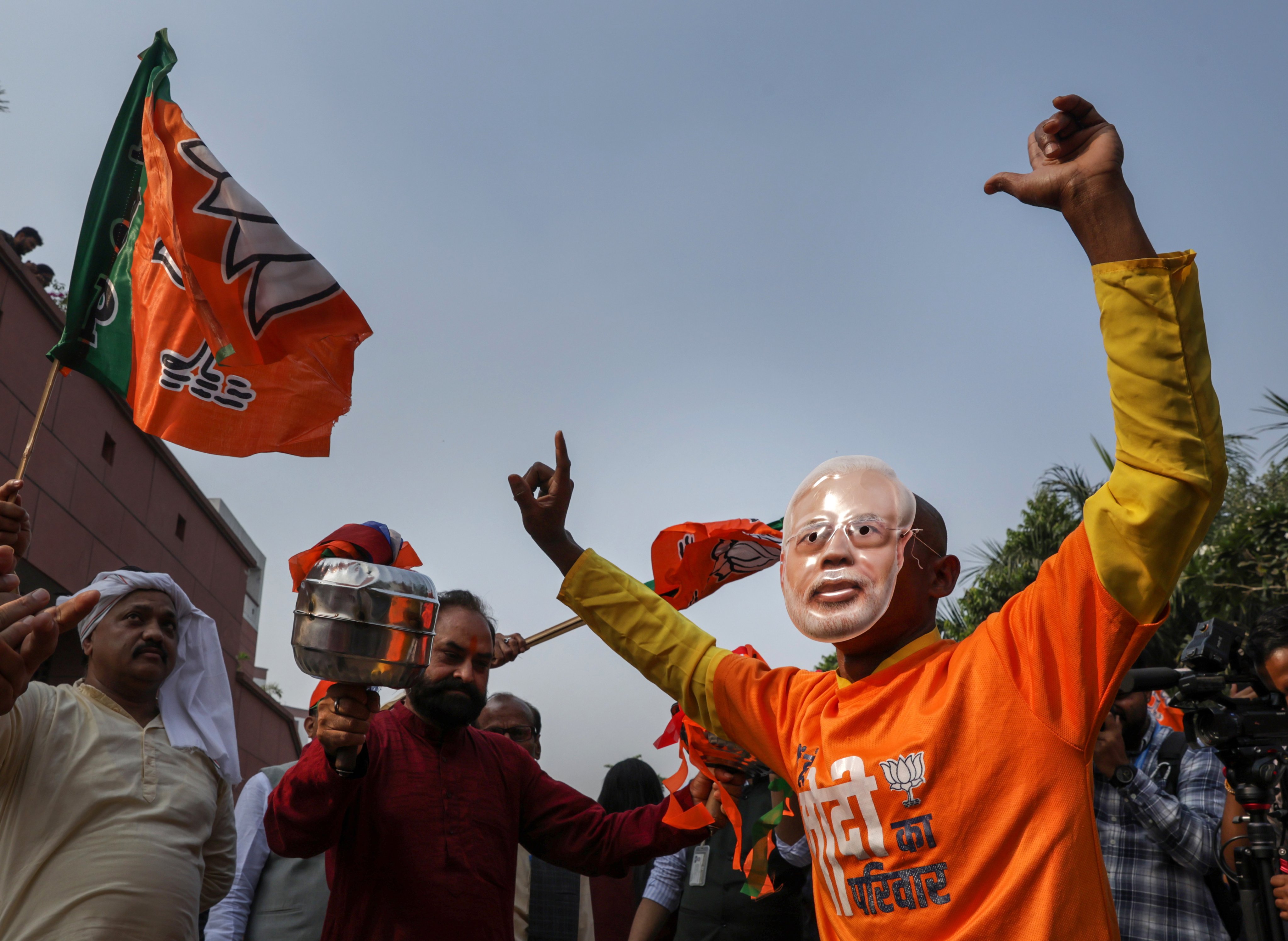 Bharatiya Janata Party supporters celebrate their party’s lead in the Bihar state election results in New Delhi, India on Friday. Photo: EPA