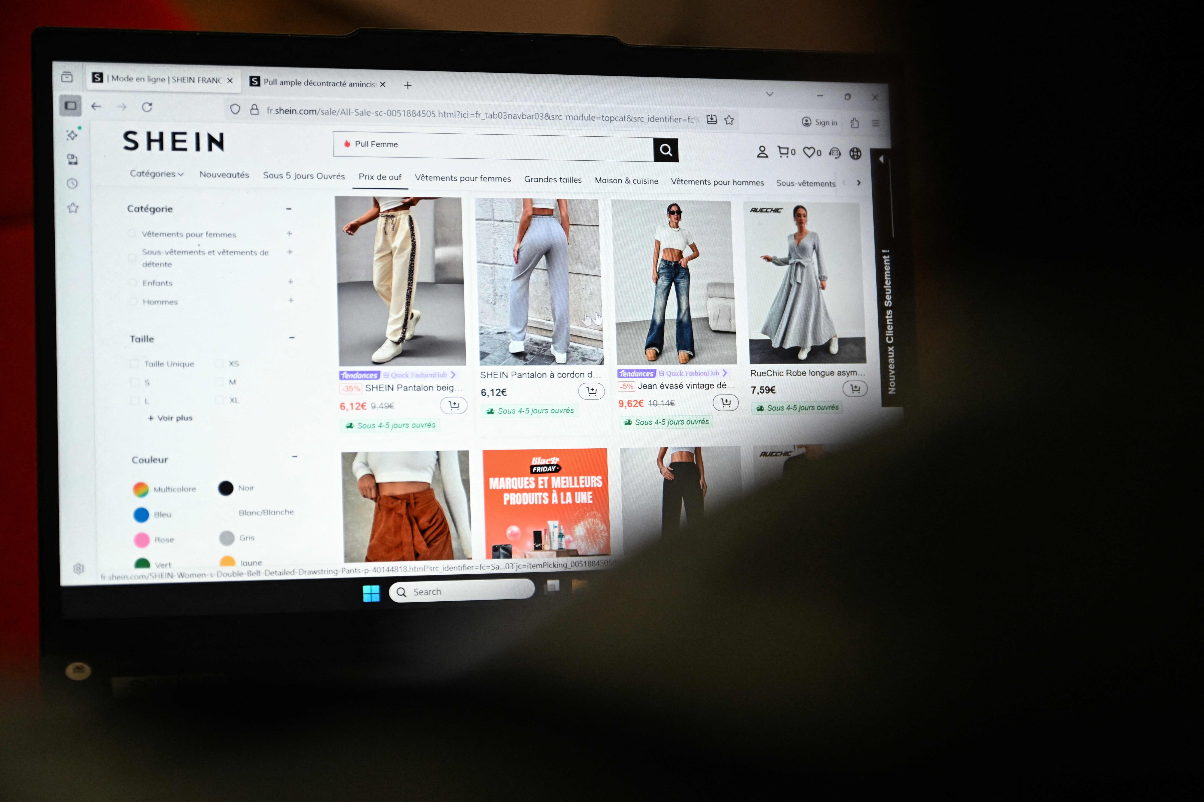 An internet user shops on the Shein website in Paris on November 5, 2025. Photo: AFP