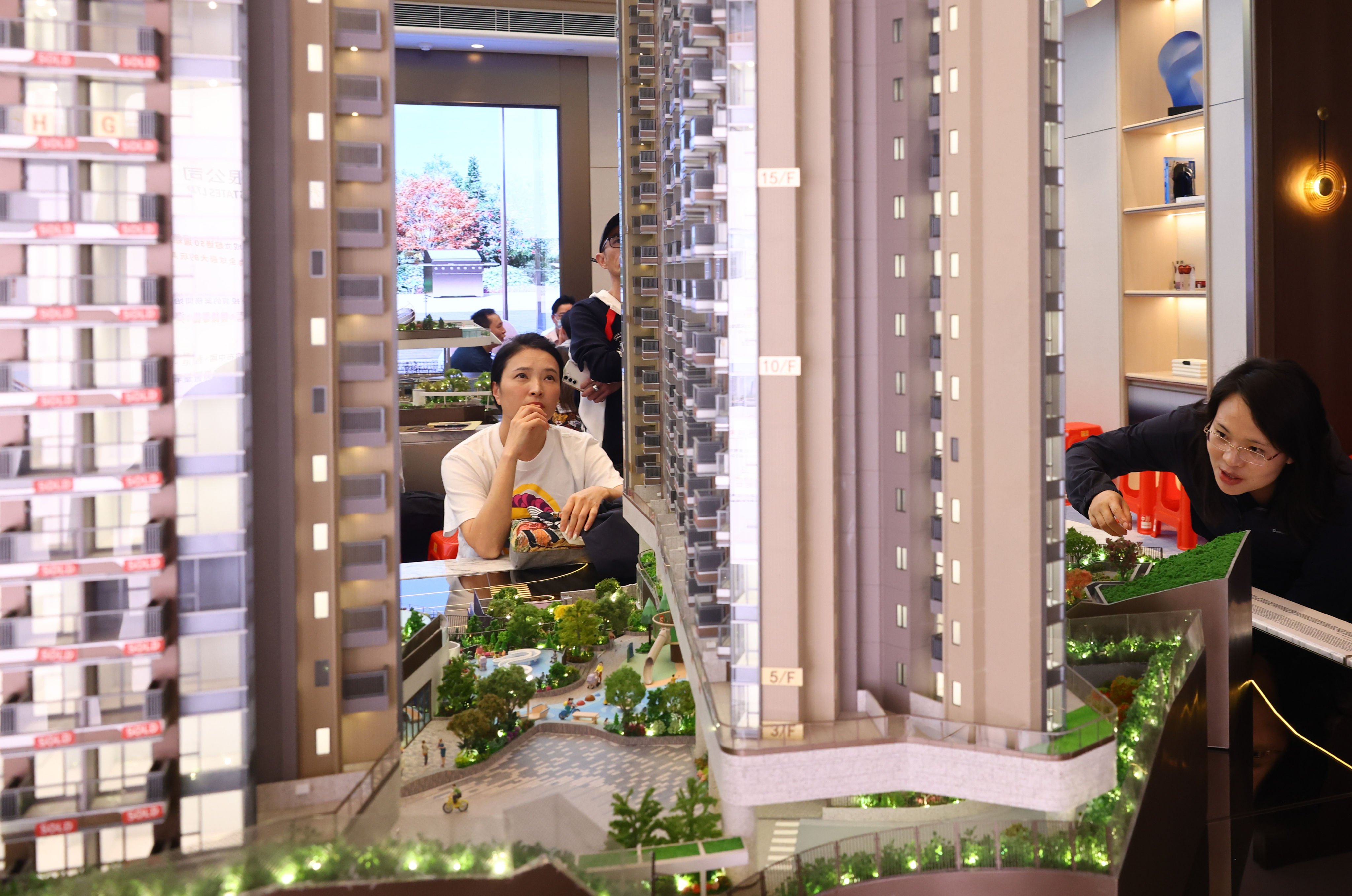 Potential homebuyers are seen at the Tsim Sha Tsui showroom of The Reserve at Gold Coast Bay in Tuen Mun. Photo: Dickson Lee