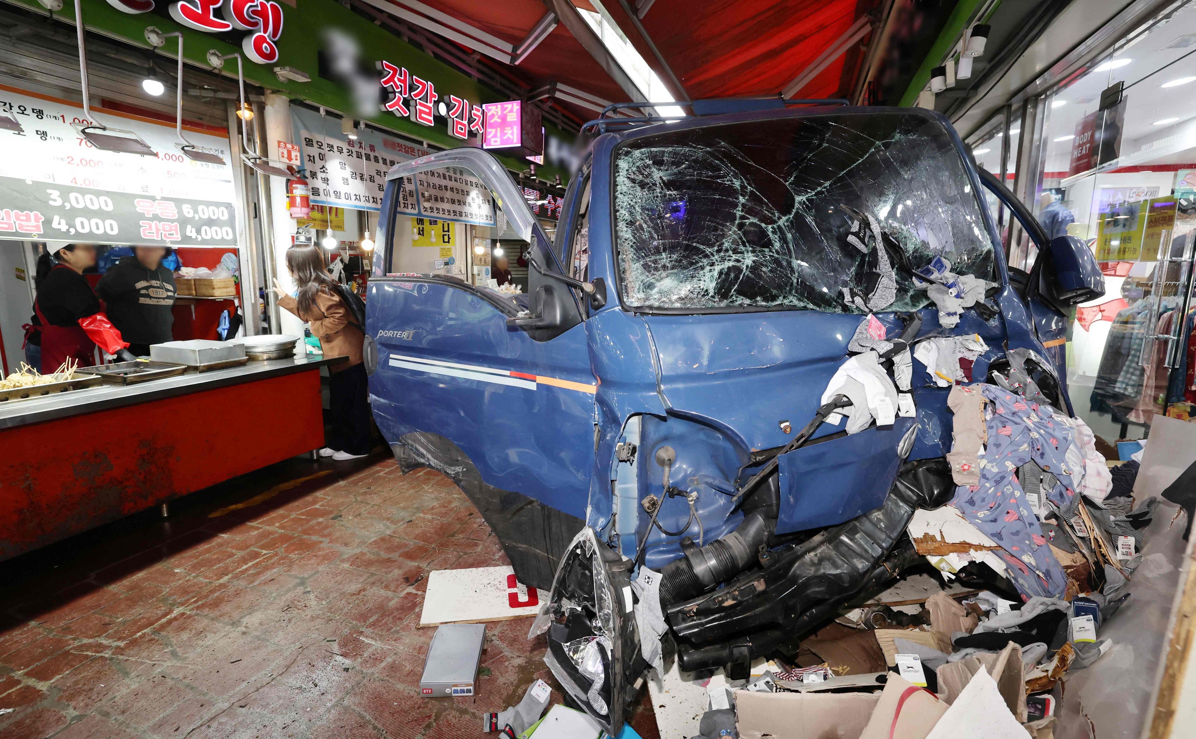 Two people die after a truck crashes into a local market in Bucheon on Thursday. Photo: Yonhap/AFP