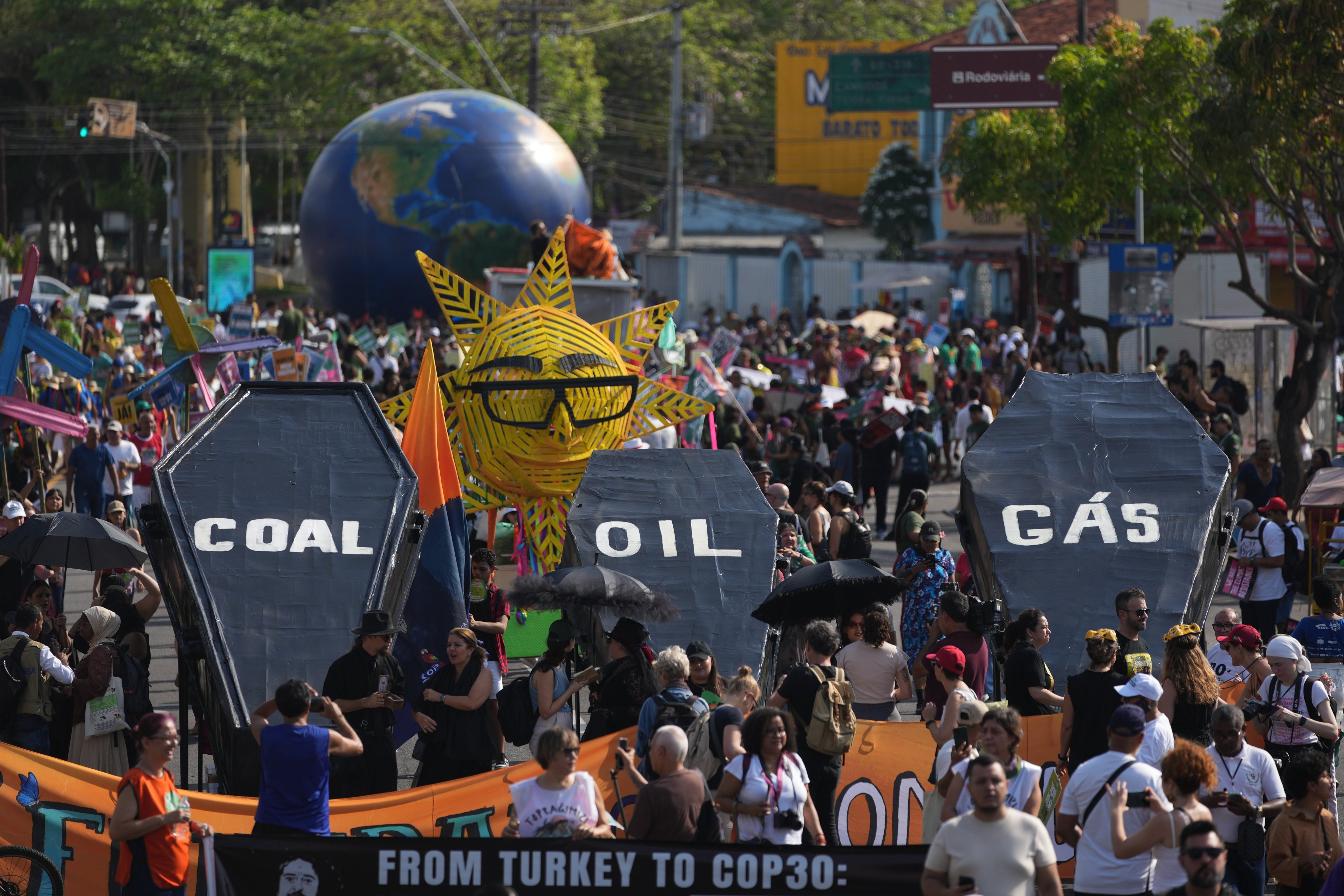 Climate activists protest with coffins that read coal, oil and gas during the C0-30 UN climate summit on Saturday in Belem, Brazil. Photo: AP