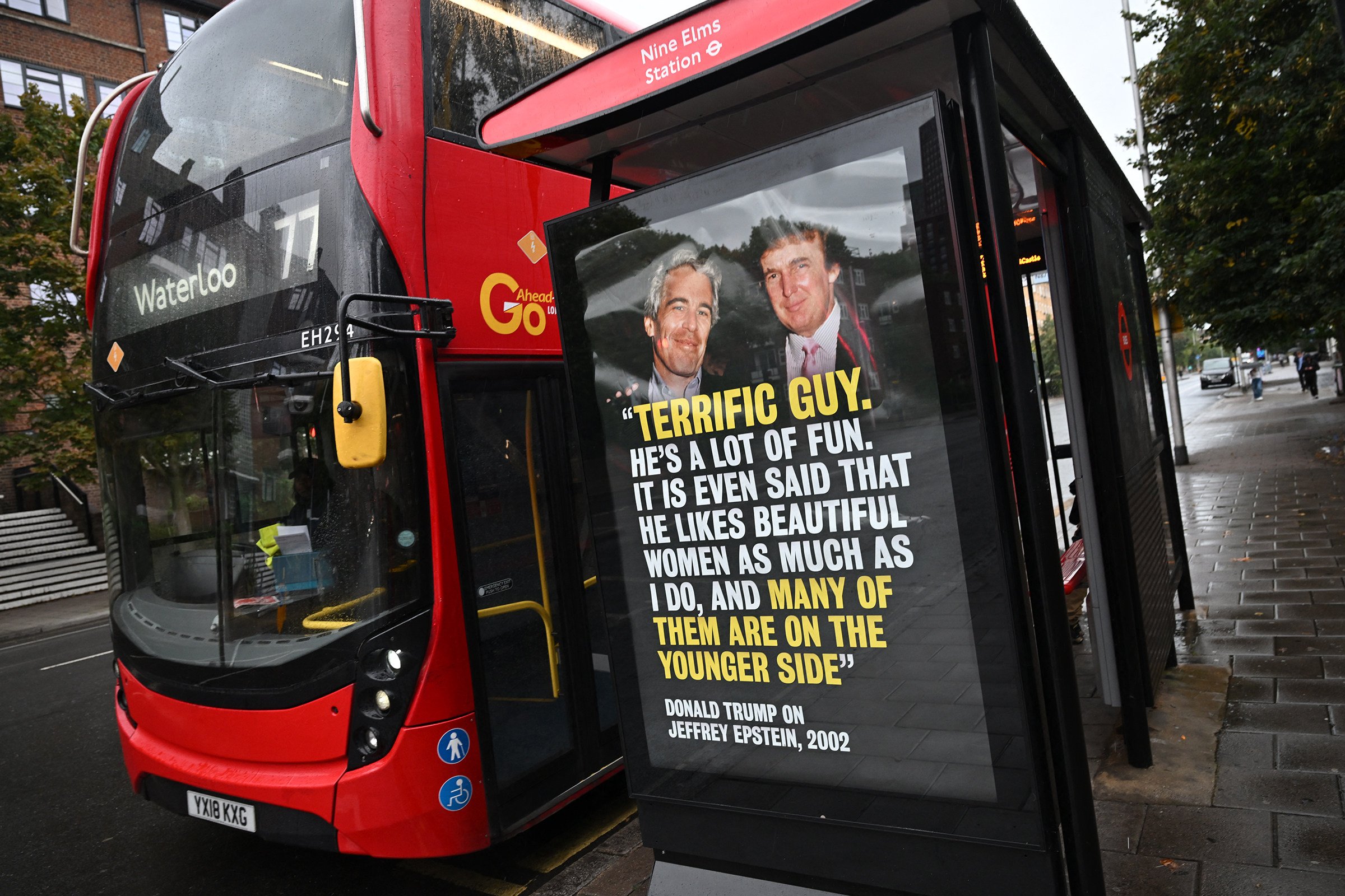 A poster with a 2002 quote by US President Donald Trump (right) about Jeffrey Epstein is seen on the side of a bus shelter in London. Photo: AFP via Getty Images/TNS