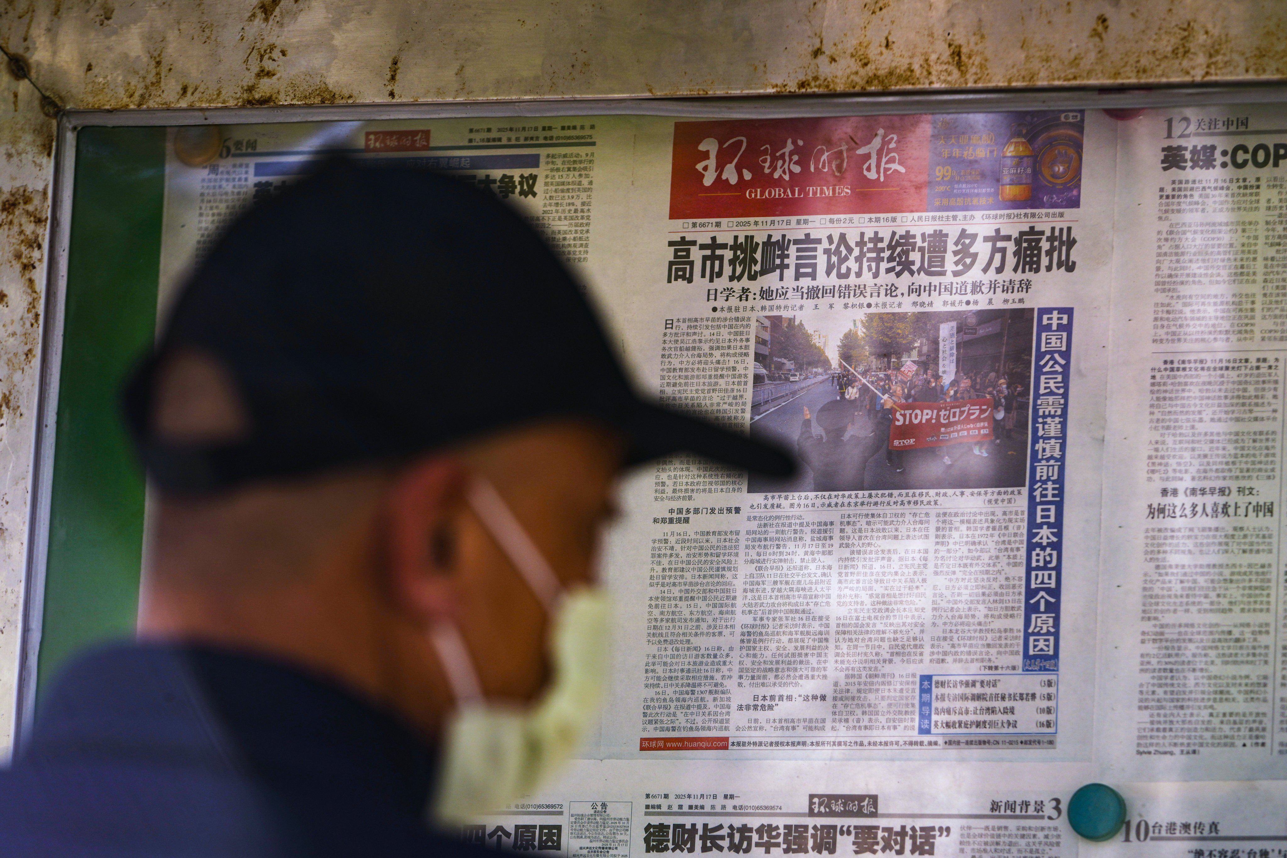 Local newspapers report on Japanese Prime Minister Sanae Takaichi’s recent remarks on Taiwan at a newsstand in Beijing on Monday. Photo: AP