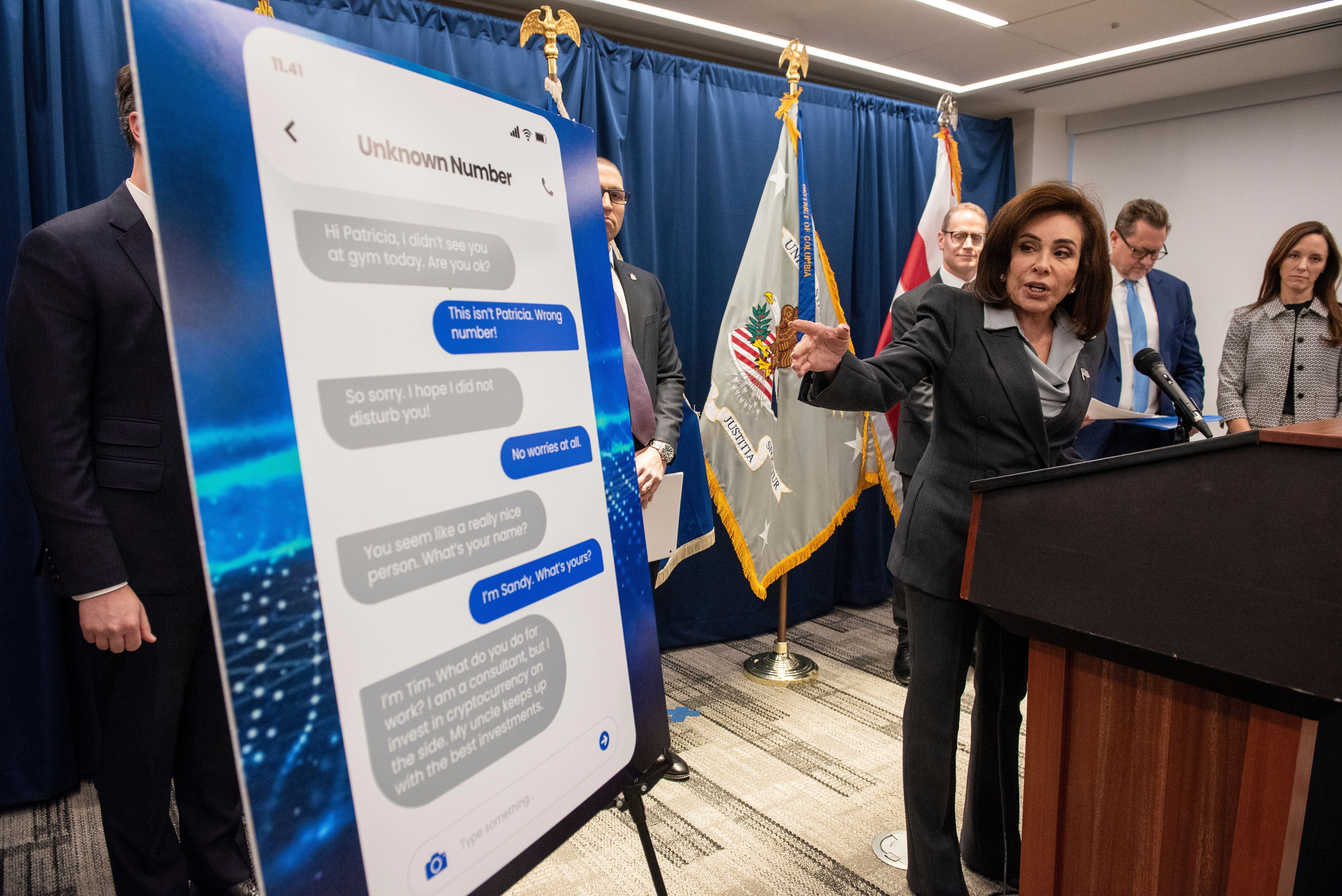 US Attorney Jeanine Pirro points to a text message sent by a scammer as she announces the Scam Centre Strike Force in Washington on Wednesday. Photo: AP