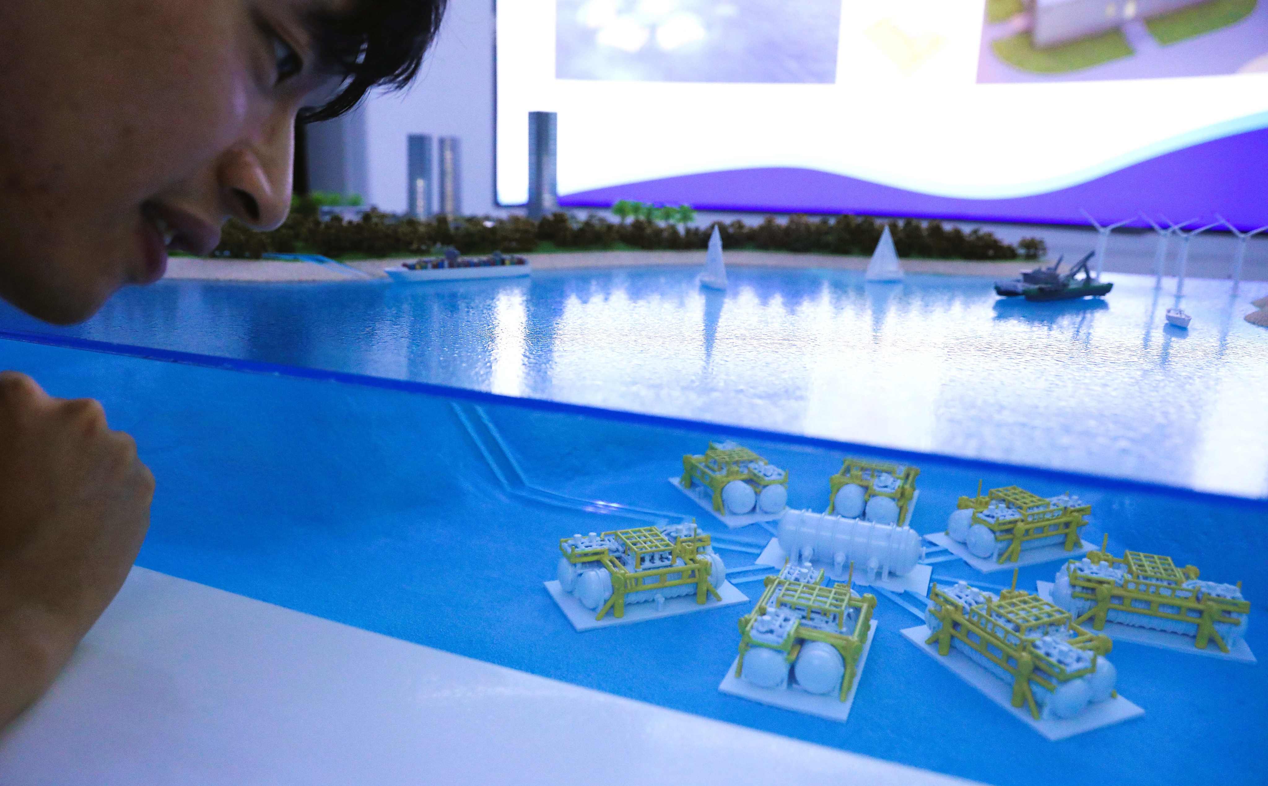 A visitor observes a miniature model of data cabins for an undersea data centre in Lingshui, in south Hainan province, on September 25. Photo: Xinhua
