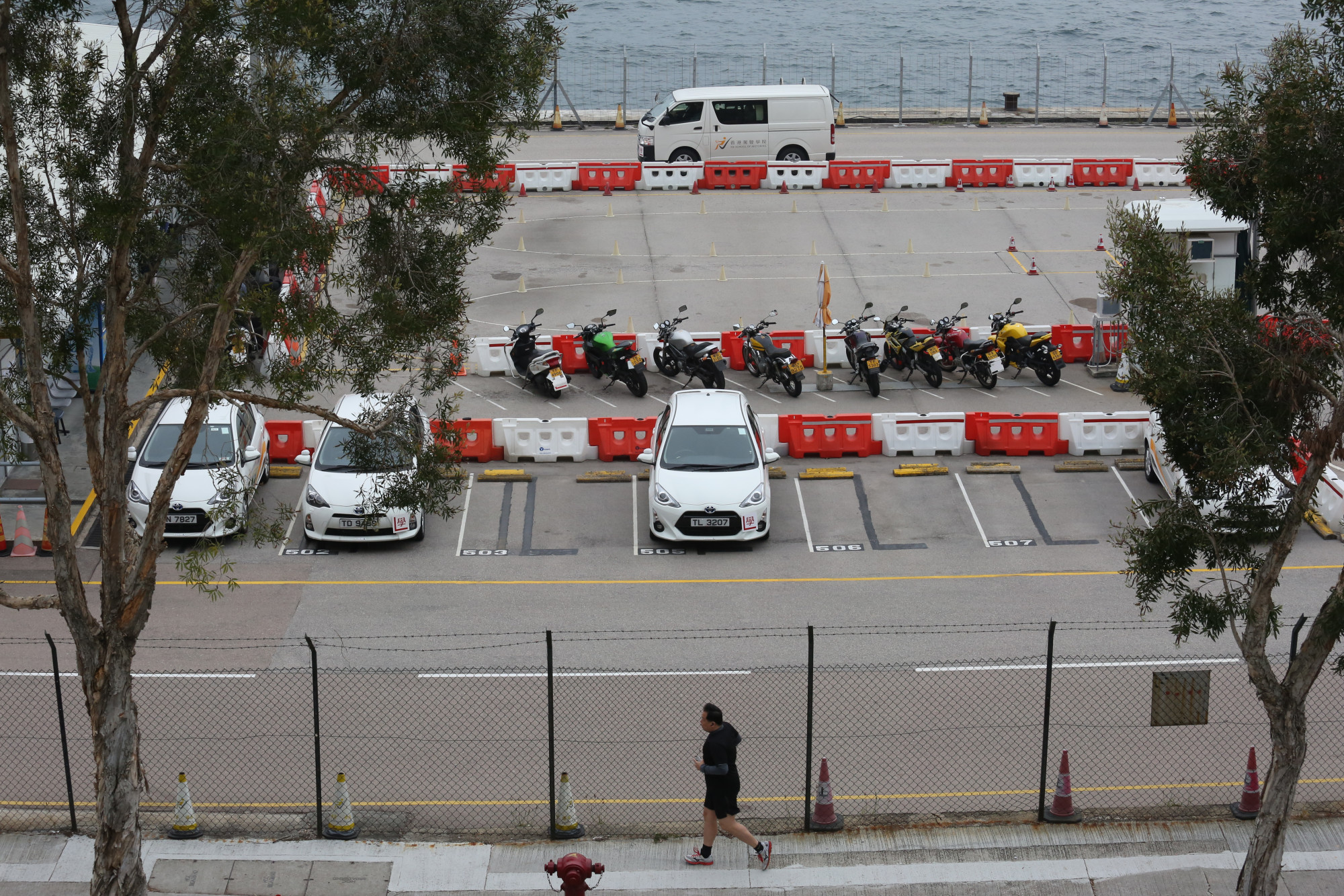 Vehicles with learner tags parked at the Hong Kong School of Motoring in Ap Lei Chau. Photo: Nora Tam