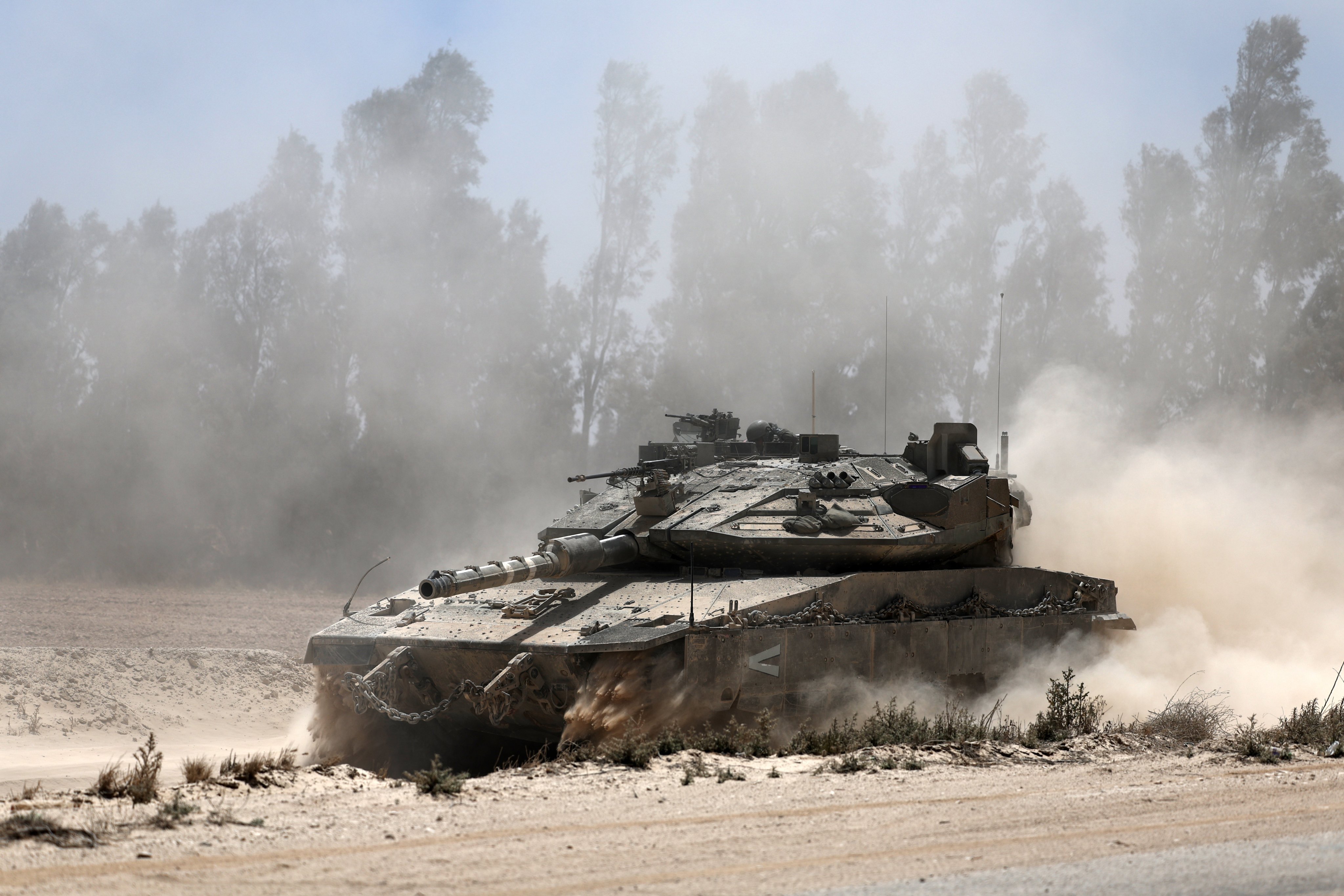 An Israeli Merkava tank manoeuvres towards the southern Gaza Strip border near Khan Younis in May. Photo: EPA-EFE
