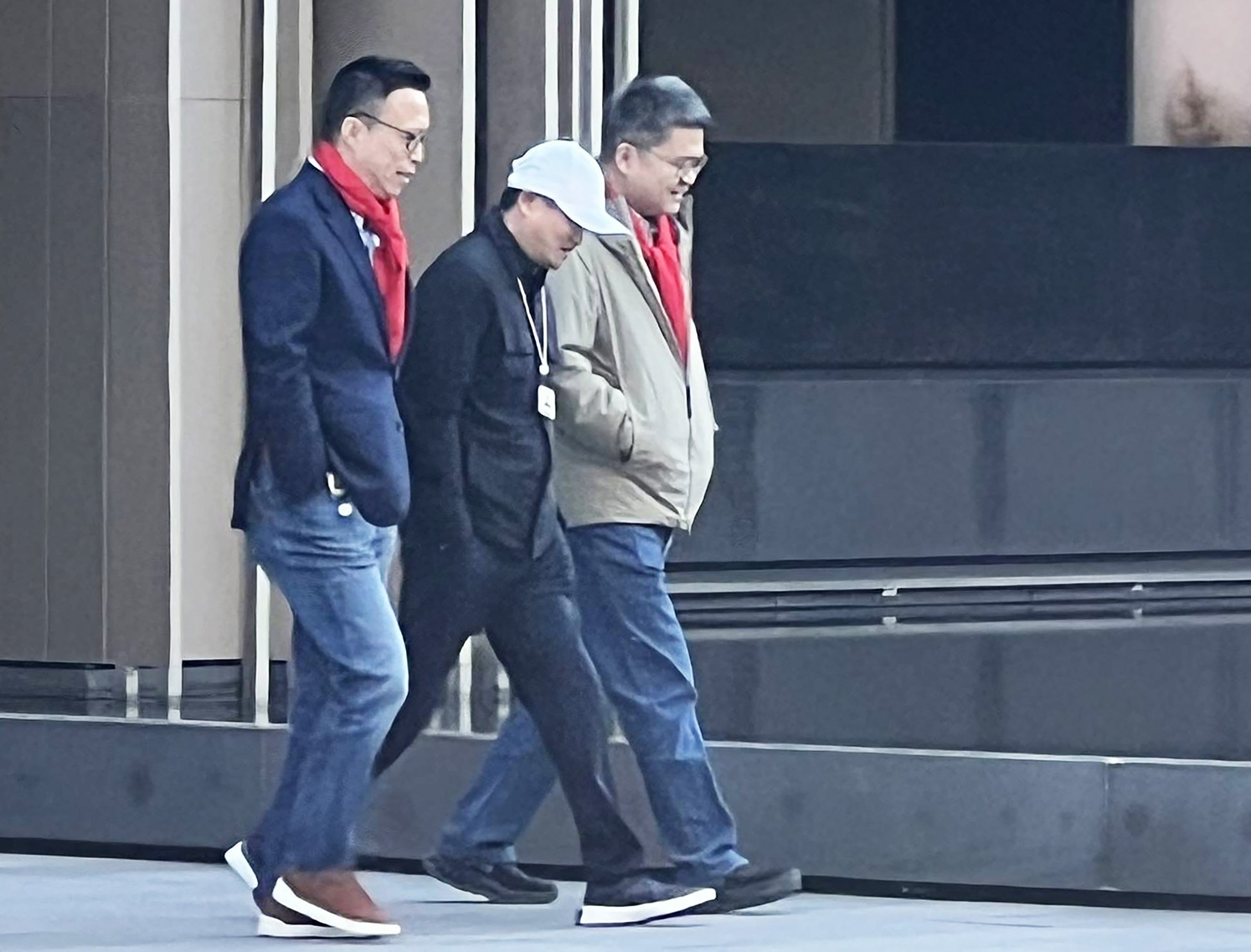 Jack Ma, wearing a white cap, walks alongside Ant Group chairman Eric Jing Xiandong (left) and CEO Cyril Han Xinyi at the fintech giant’s campus in Hangzhou. Photo: Handout