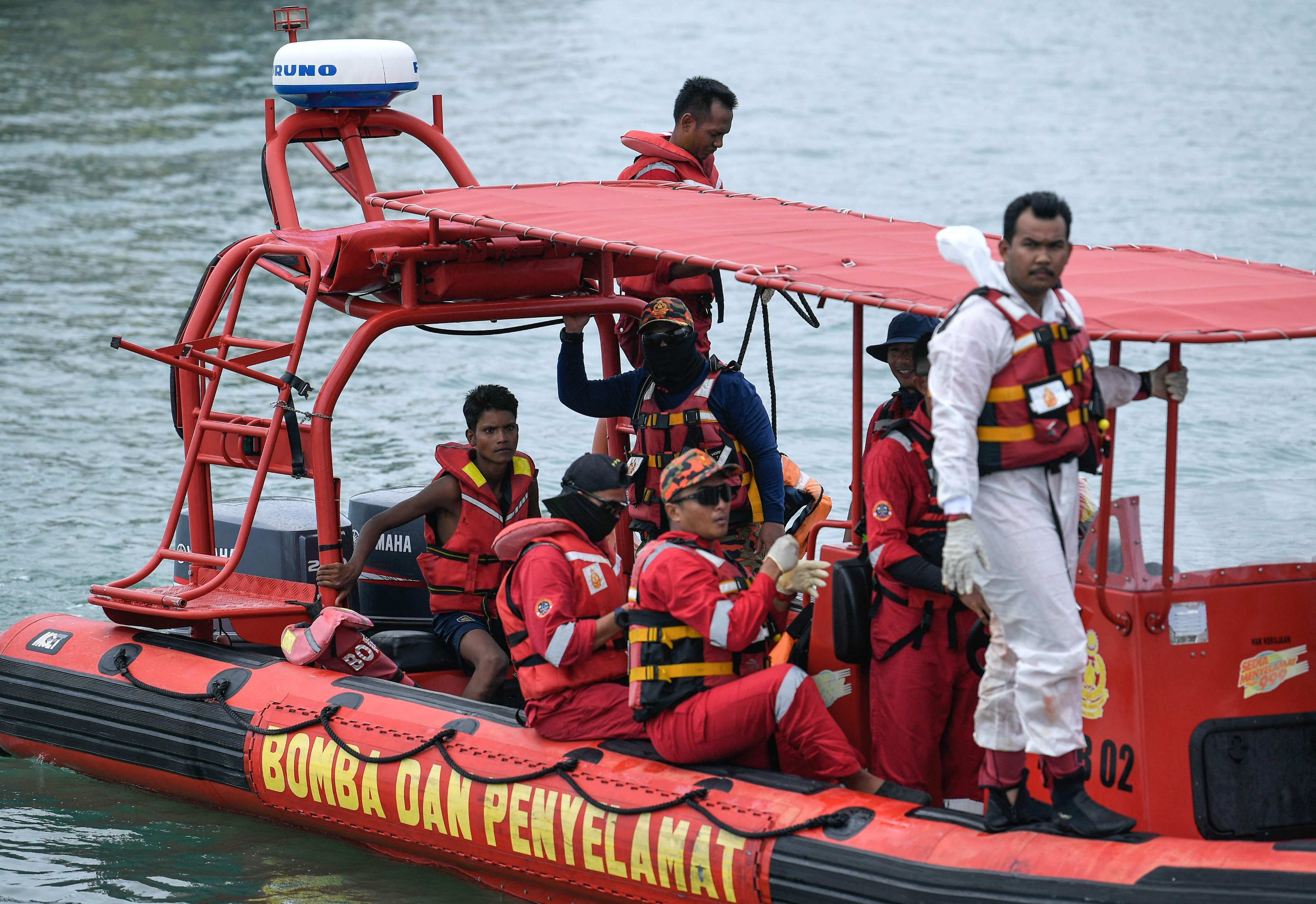 Rescuers approached a Langkawi jetty earlier this month after saving Rohingya migrant Iman Shorif (left). His boat, carrying migrants from Myanmar, had capsized days earlier near the Malaysia-Thailand border. Photo: AFP
