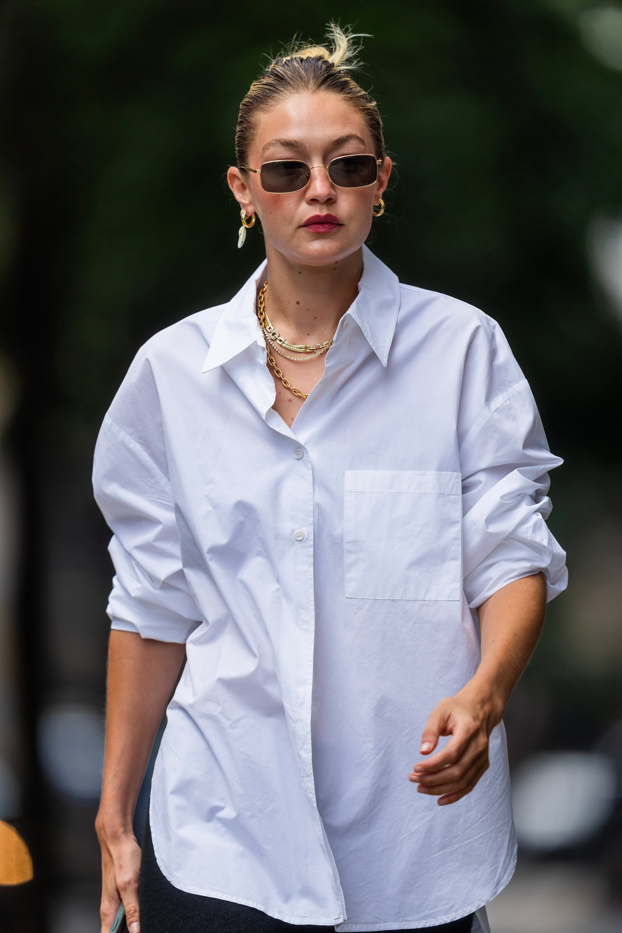 Gigi Hadid layered several gold chain necklaces while out and about in New York in August 2023. Photo: GC Images