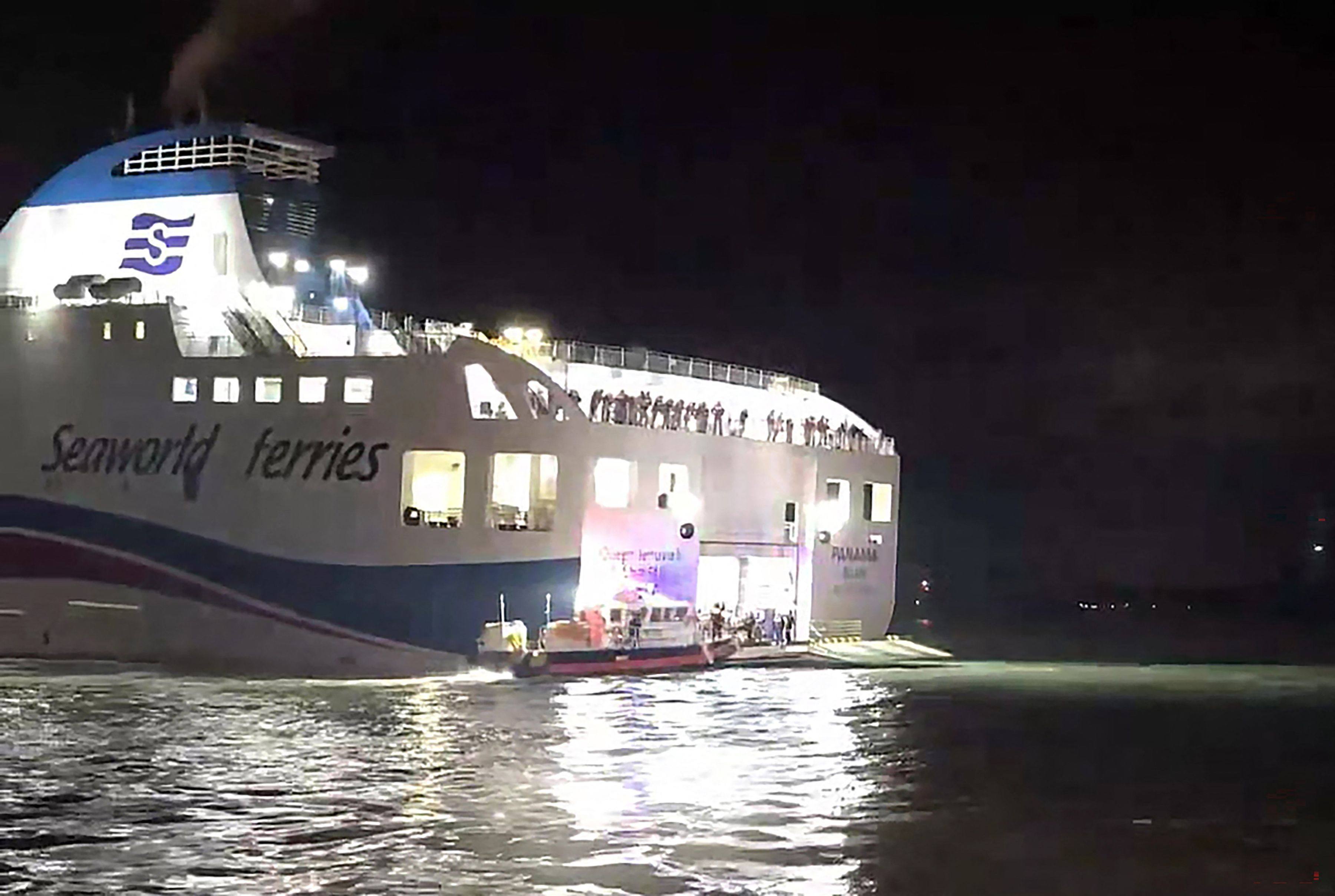 Coastguard personnel rescue passengers of a grounded ferry near Jangsan Island in Sinan county, South Korea, on Wednesday. Photo: Mokpo Coastguard/AFP