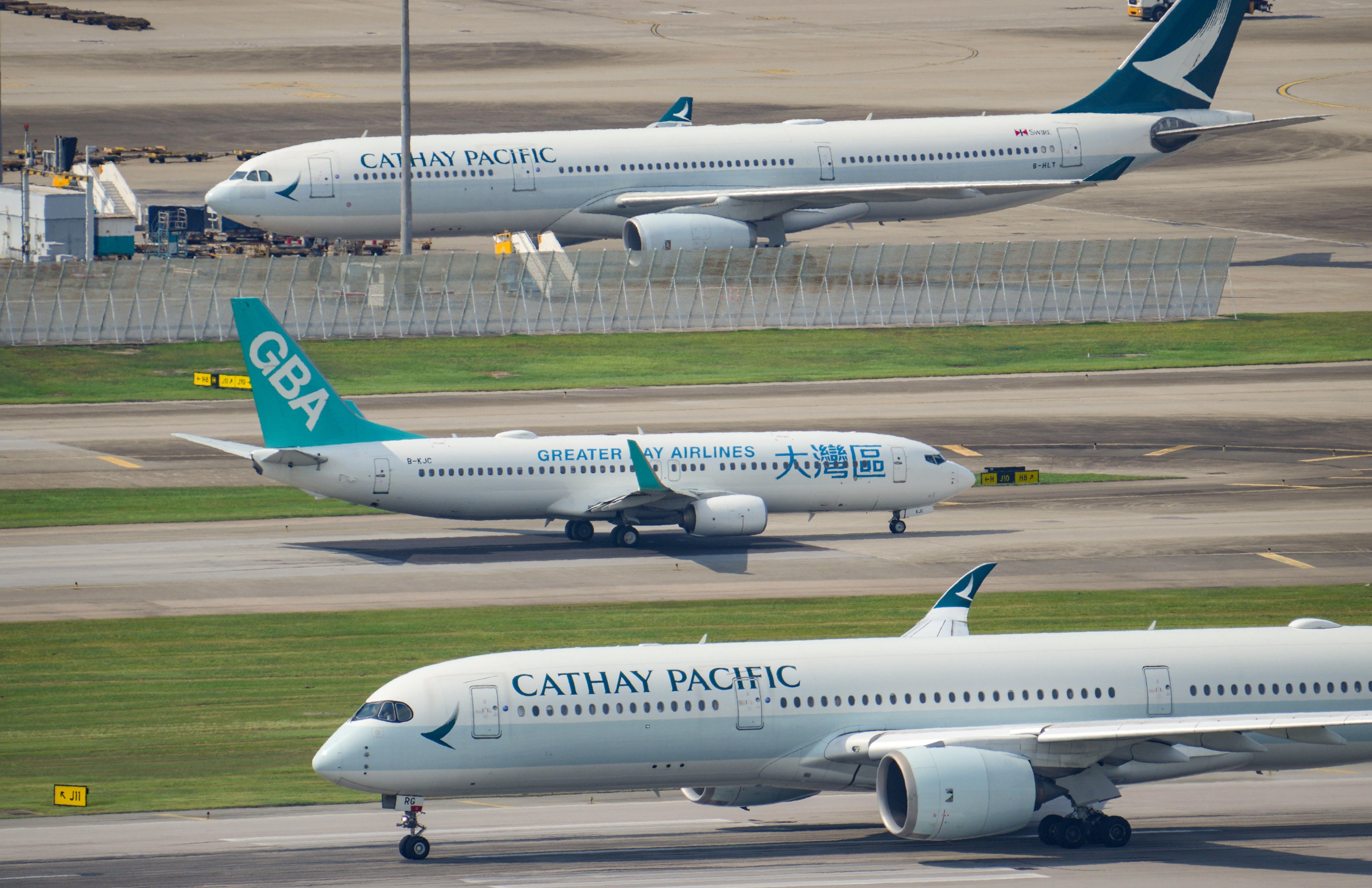 Greater Bay Airlines and Cathay Pacific aircraft at Hong Kong International Airport. Photo: May Tse