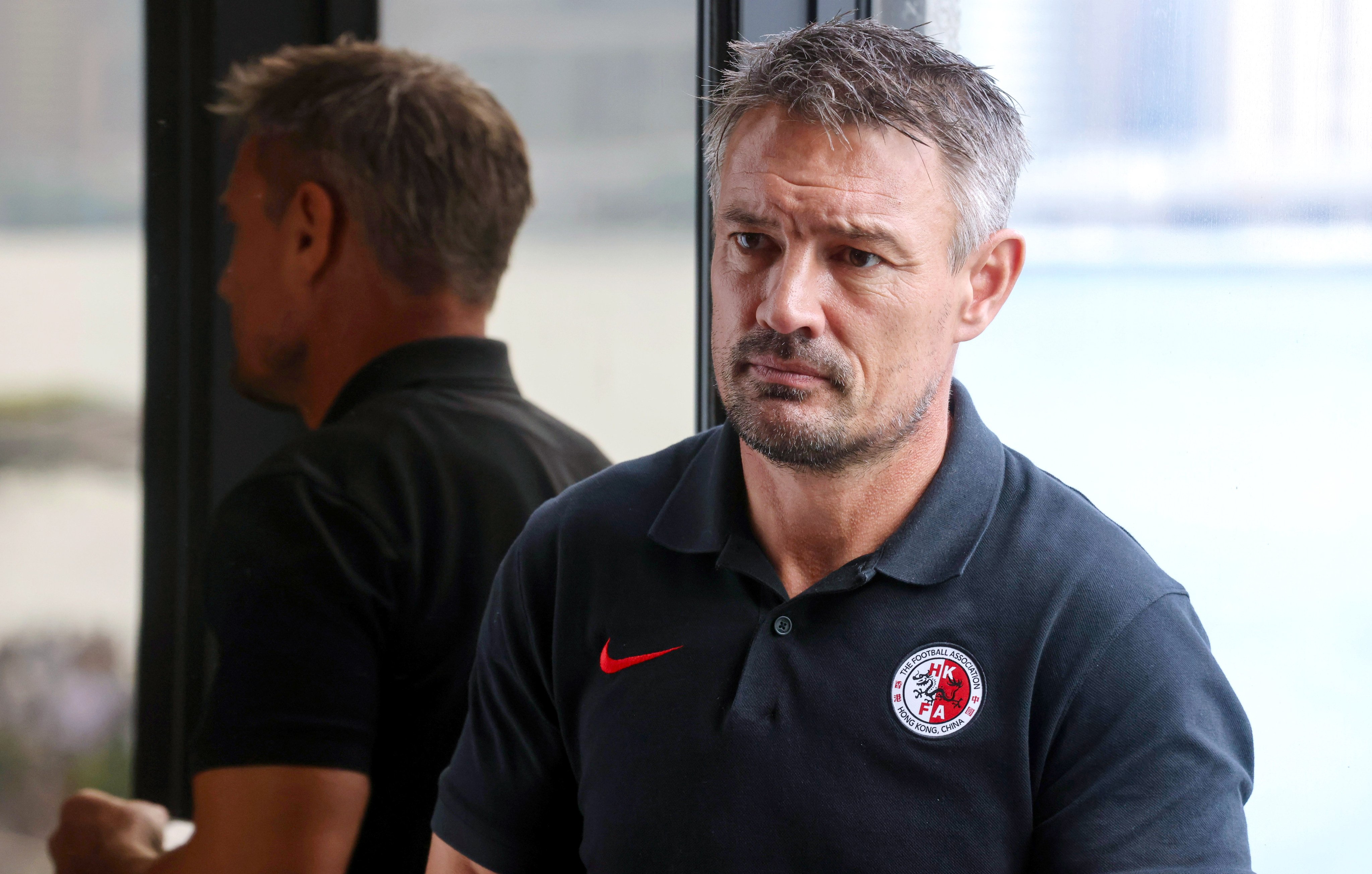Ashley Westwood speaks to the media before the game against Singapore that appears likely to have been his last in charge. Photo: Jonathan Wong