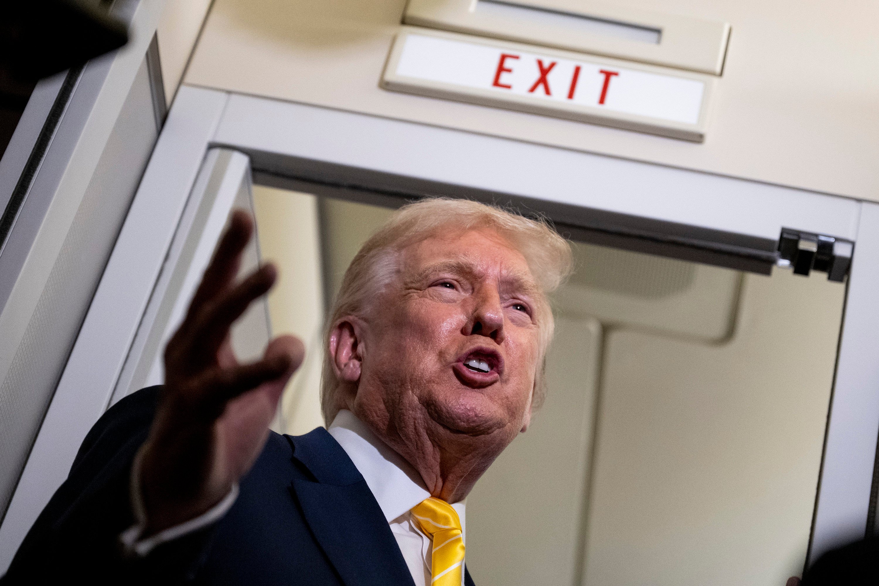 US President Donald Trump speaks to media aboard Air Force One on November 14, while in flight from Washington to West Palm Beach International Airport. Photo: Getty Images/TNS