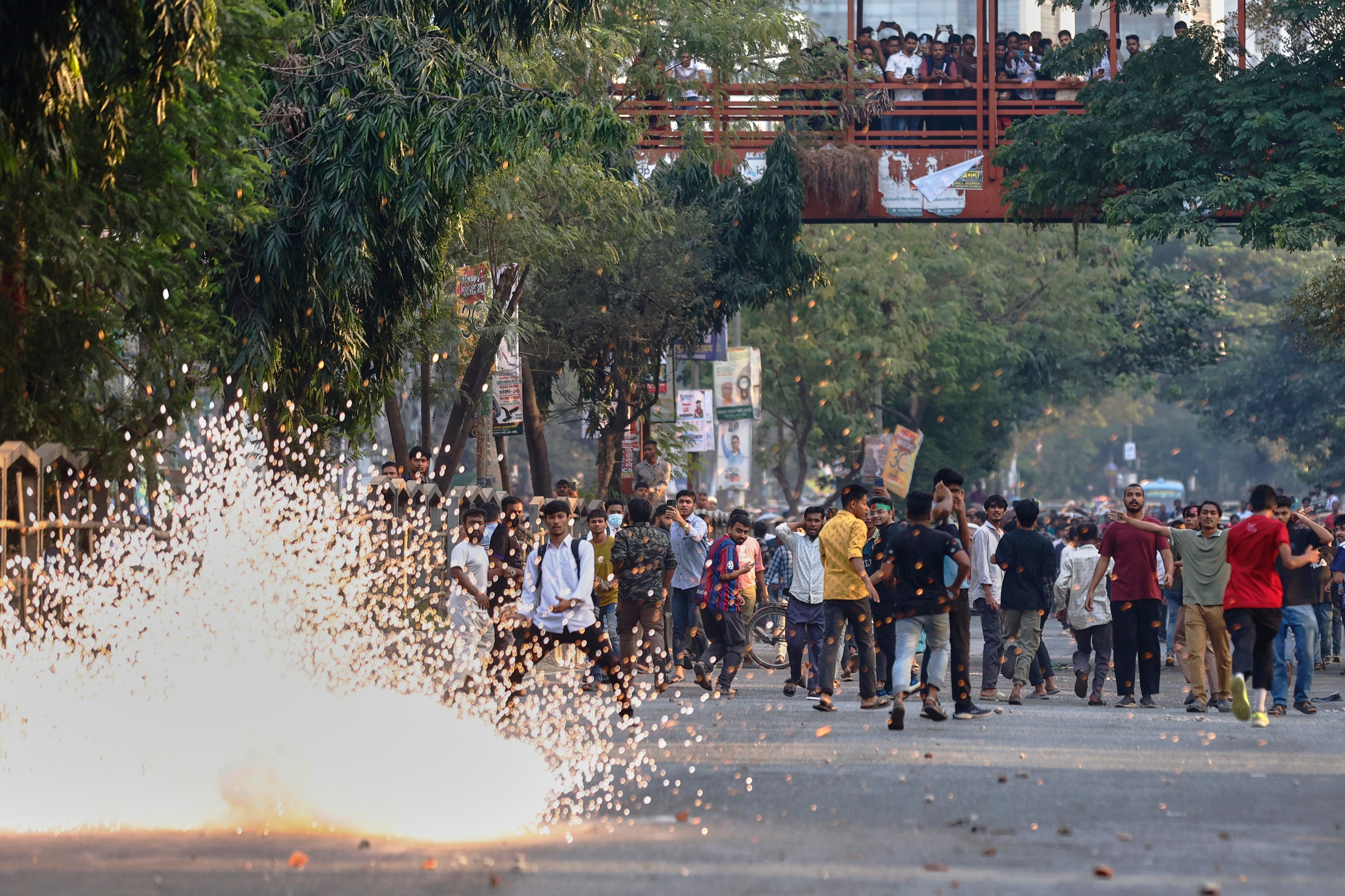 Police use stun grenades to disperse protesters outside the demolished residence of Sheikh Mujibur Rahman, Bangladesh’s former leader and father of ousted prime minister Sheikh Hasina, on Monday. Photo: AP