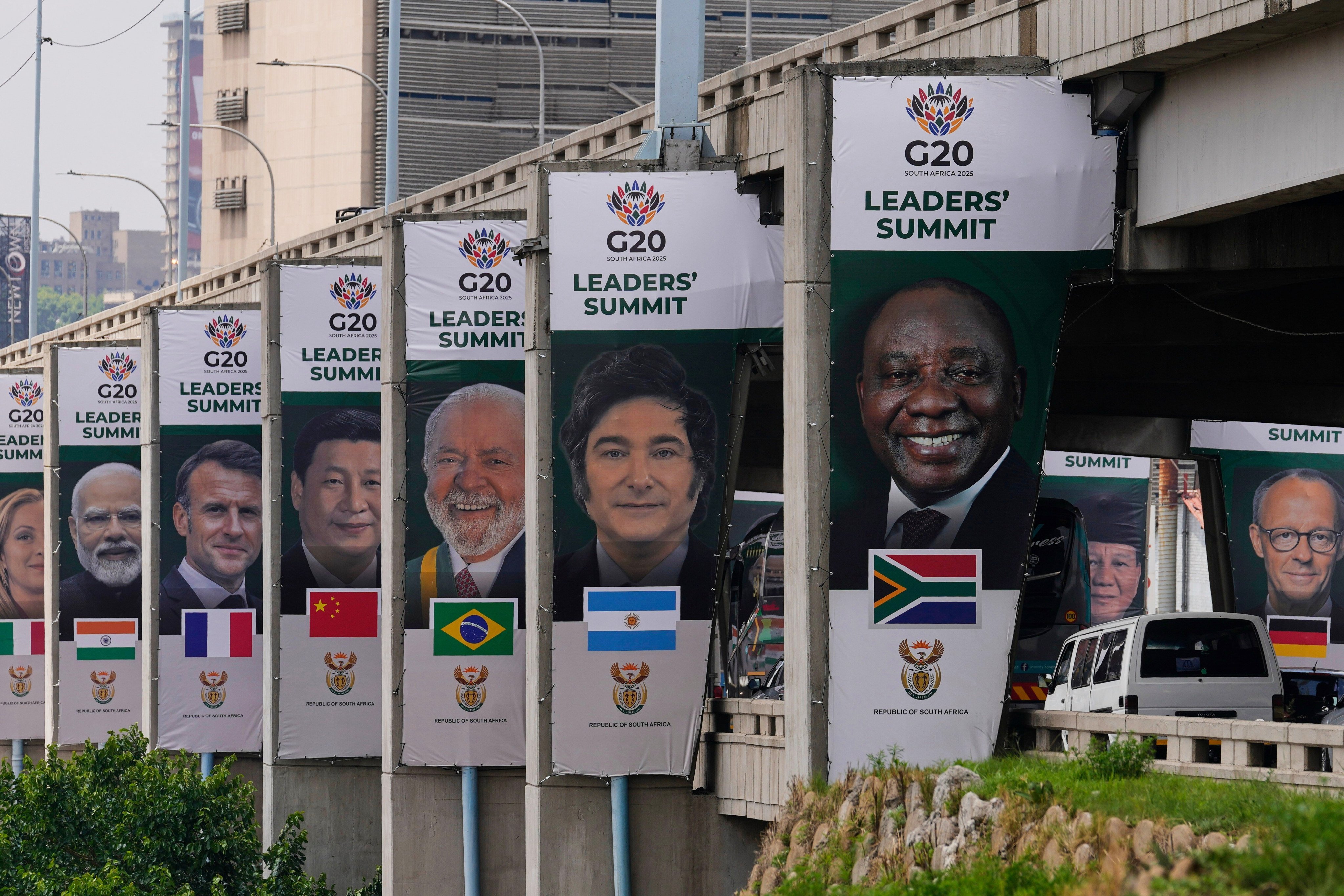 Banners displaying the faces of various G20 leaders displayed along a Johannesburg freeway. Photo: AP