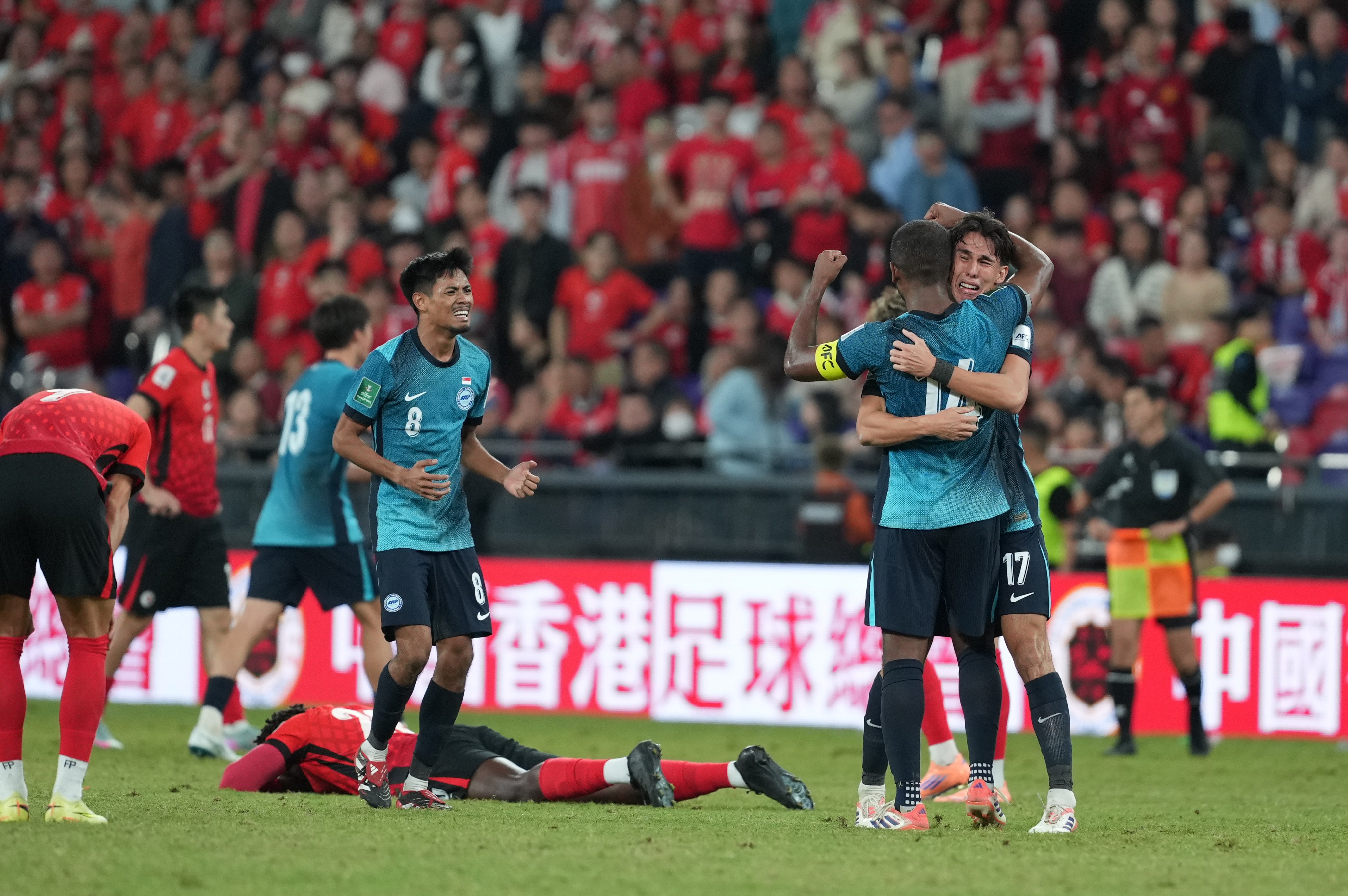 Singapore’s players celebrate their win over Hong Kong in the Asian Cup qualifiers at Kai Tak Stadium on Tuesday. Photo: Sam Tsang