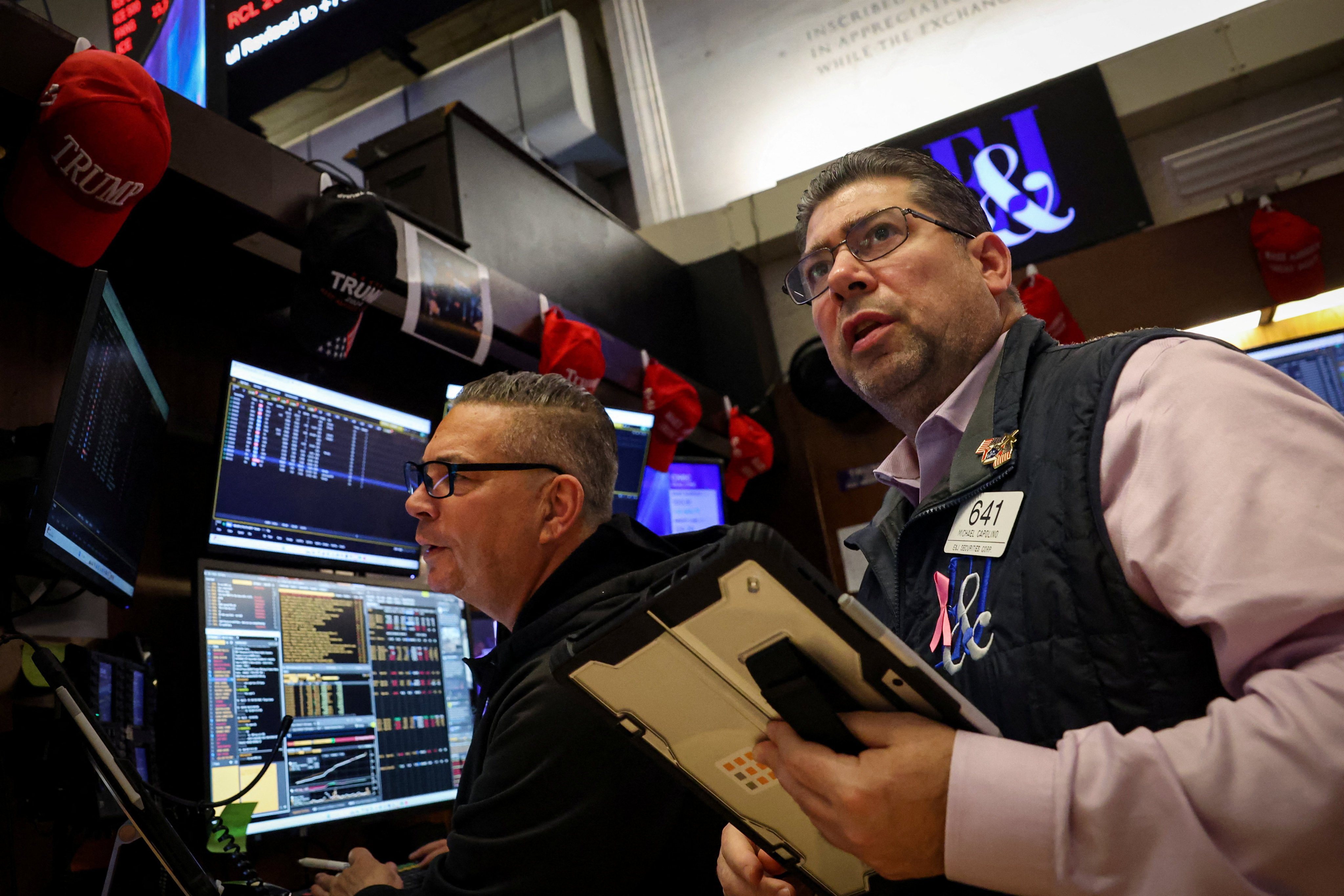 Traders work on the floor at the New York Stock Exchange on Thursday. Photo: Reuters