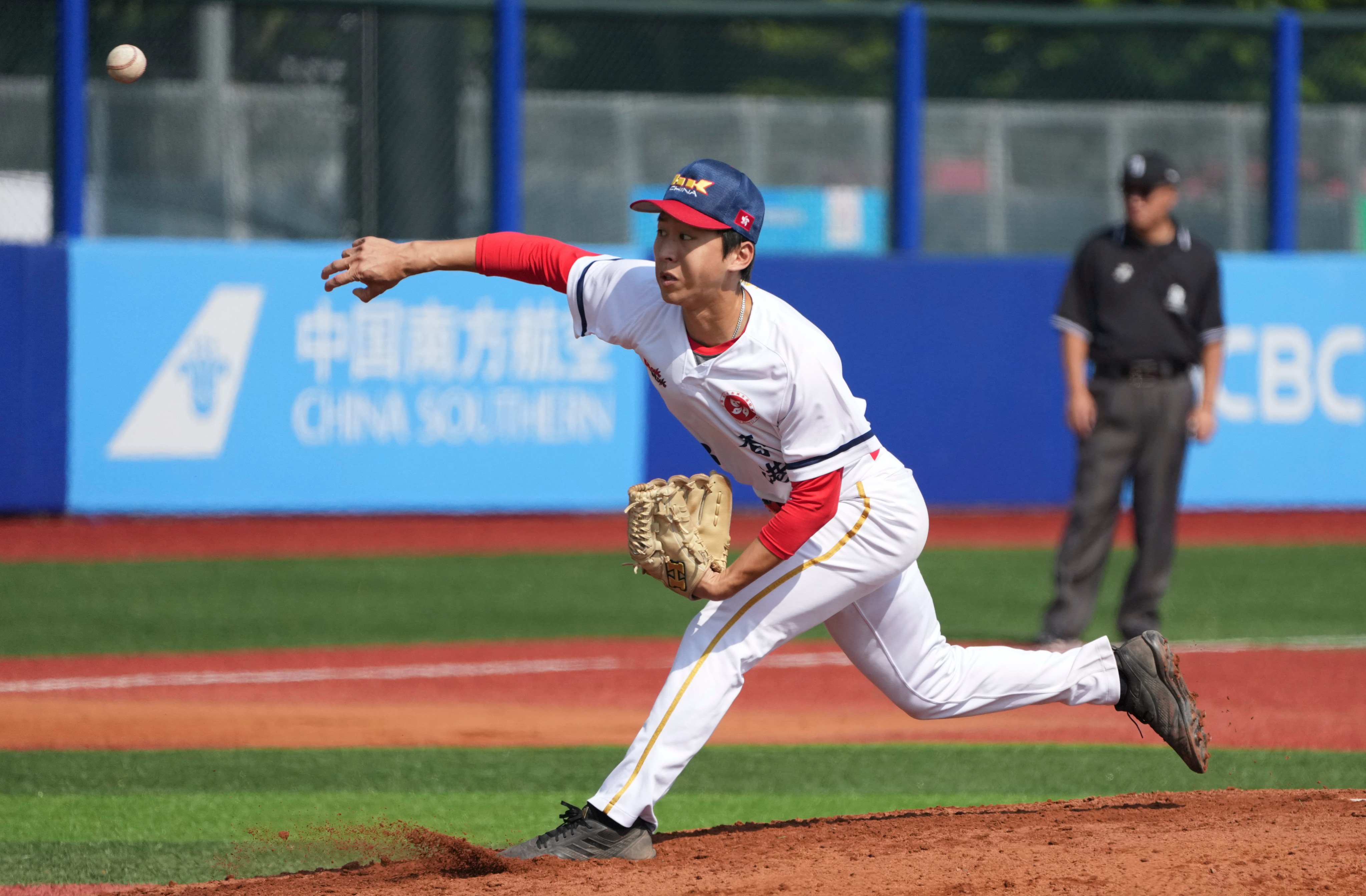 Hong Kong’s Leung Ka-ho throws a pitch during the 5-4 group game defeat against Fujian on Monday. Photo: Xinhua