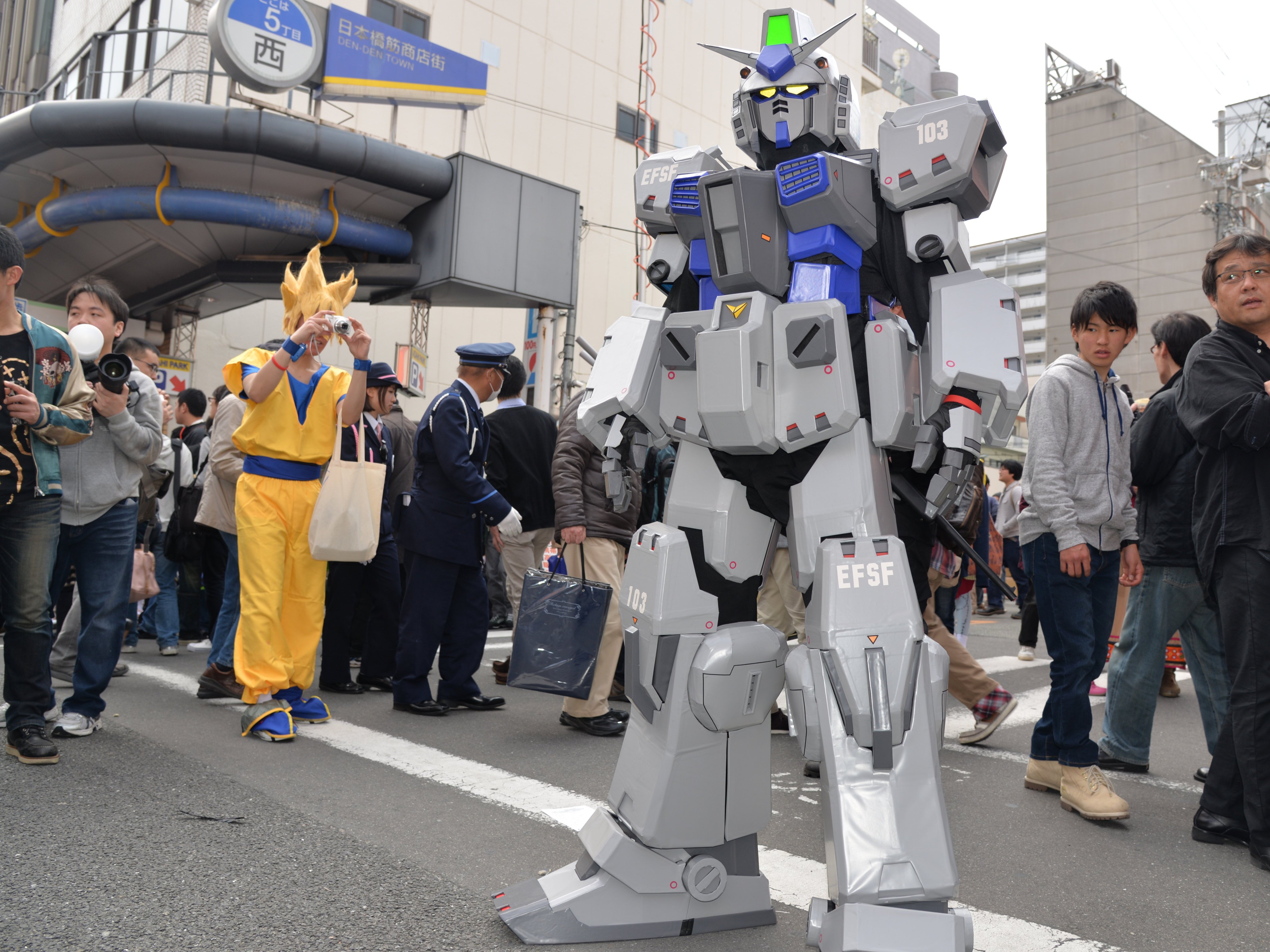 Cosplayers dressed as Goku and a Gundam character at the Nippombashi Street Festa in Osaka. Such fan-driven events reflect the deep-rooted pop-culture communities that oshikatsu has helped bring further into the mainstream. Photo: Xinhua