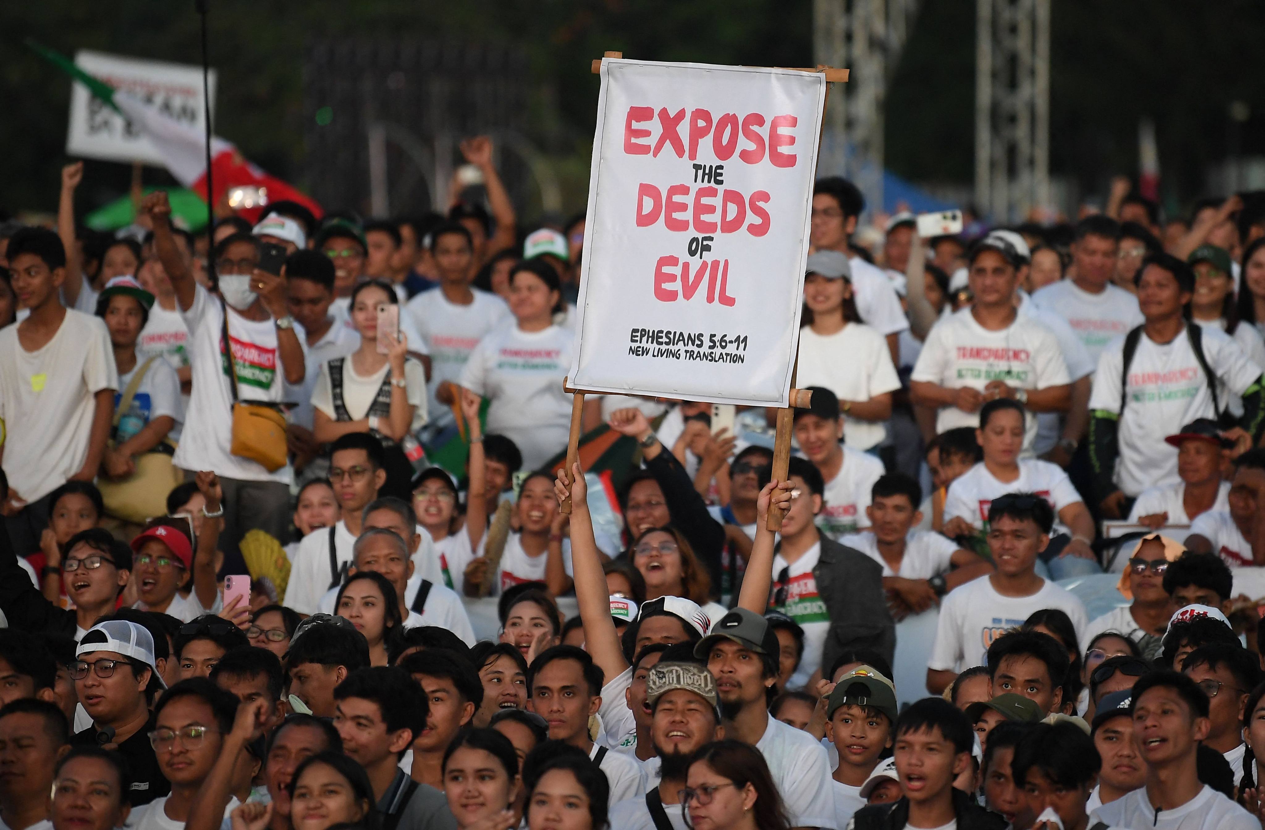 Members of the religious sect Iglesia ni Cristo listen to speeches during an anti-corruption protest at a park in Manila on Monday. The rally drew more than half a million church members. Photo: AFP