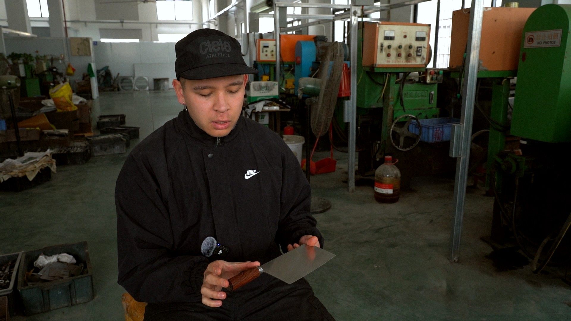 Sean Warmington-Wan examines one of his Chinese chef’s knives at a factory in Yangjiang, southern China. Photo: Fragrant Knives