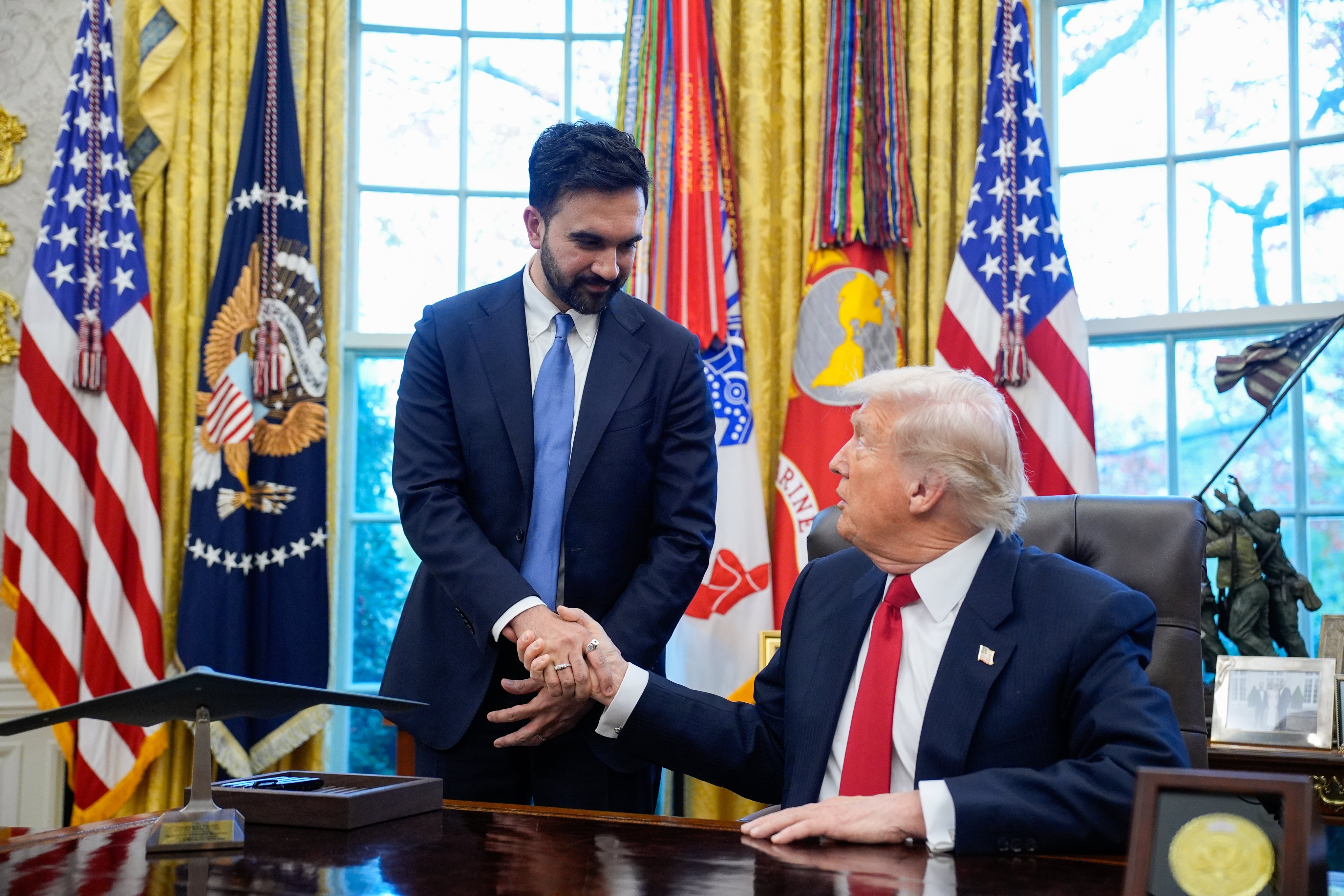 US President Donald Trump (right) shakes hands with Zohran Mamdani, New York City’s mayor-elect, in the Oval Office at the White House on Friday. Photo: EPA