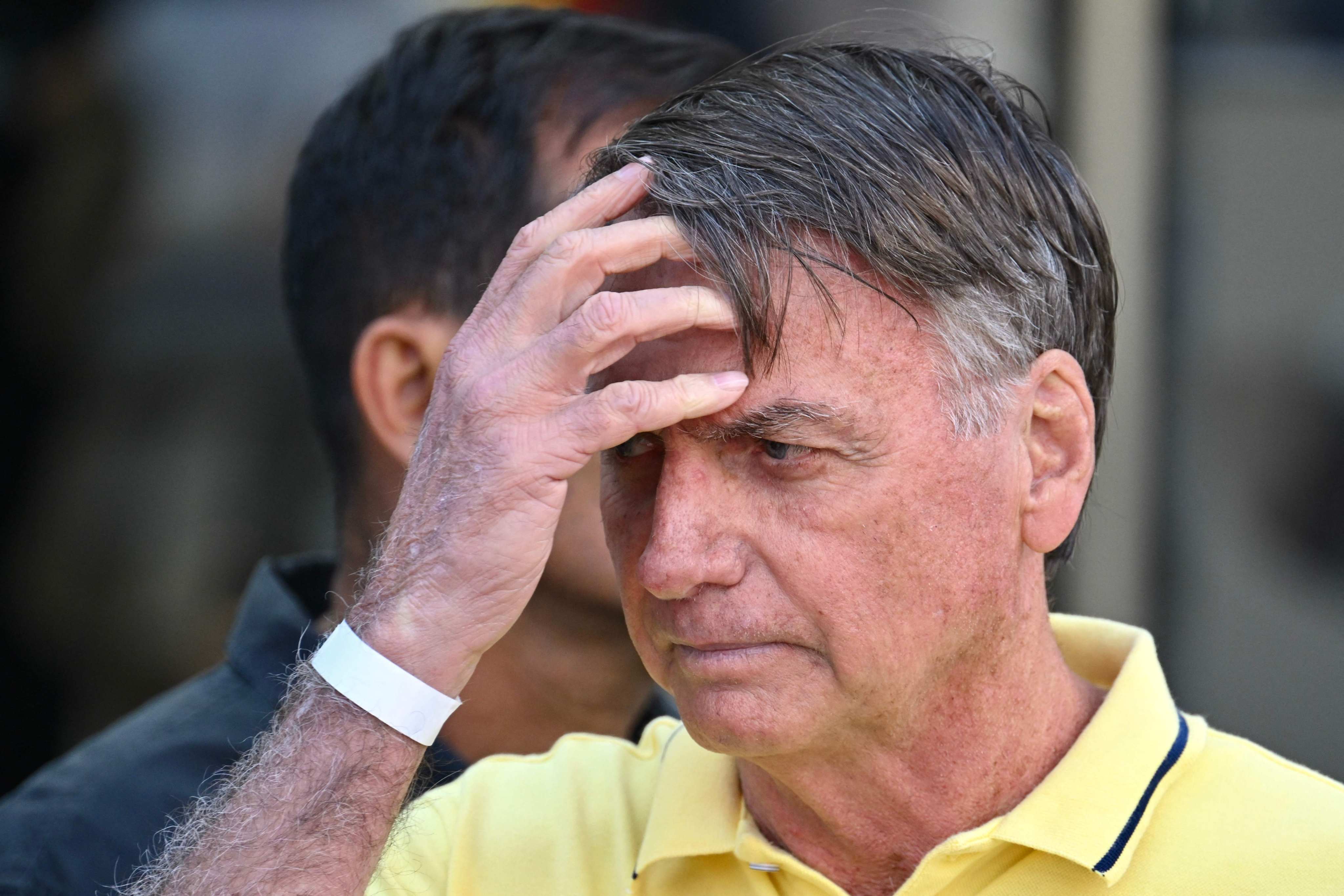 Former Brazilian president Jair Bolsonaro gestures after taking medical tests at a hospital in Brasilia in August. Photo: AFP