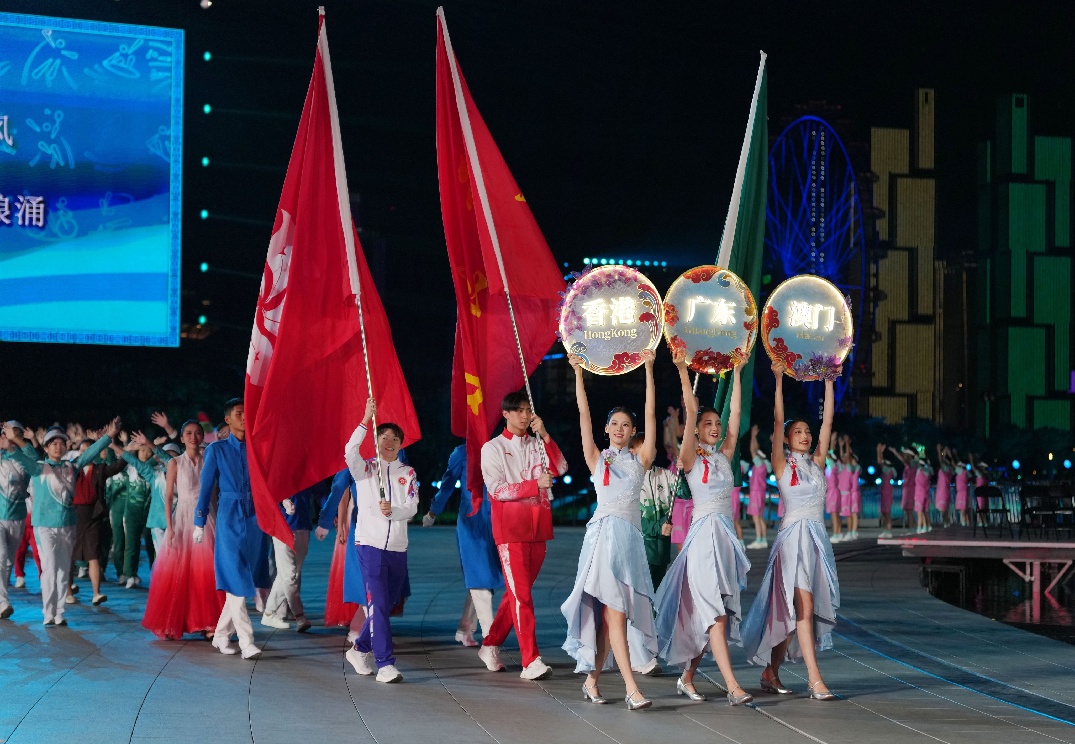Members of the Guangdong province, Hong Kong and Macau delegations take part in the closing ceremony of the 15th National Games. Photo: Xinhua