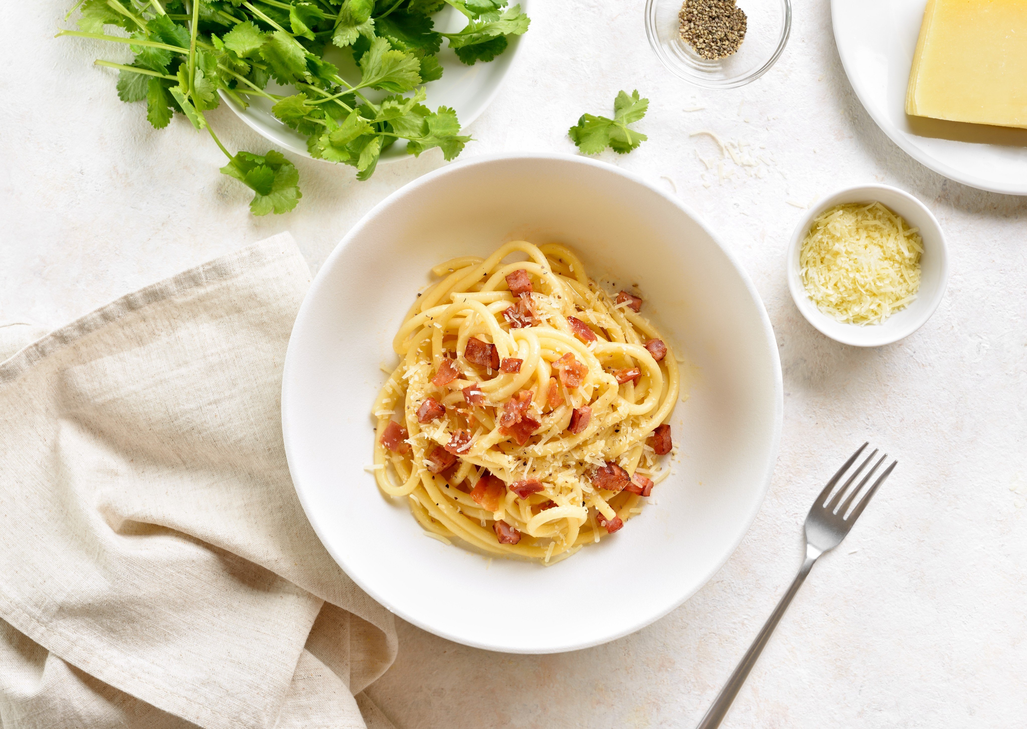 Pasta carbonara is sometimes made with pancetta, but the traditional ingredient is guanciale. Photo: Shutterstock