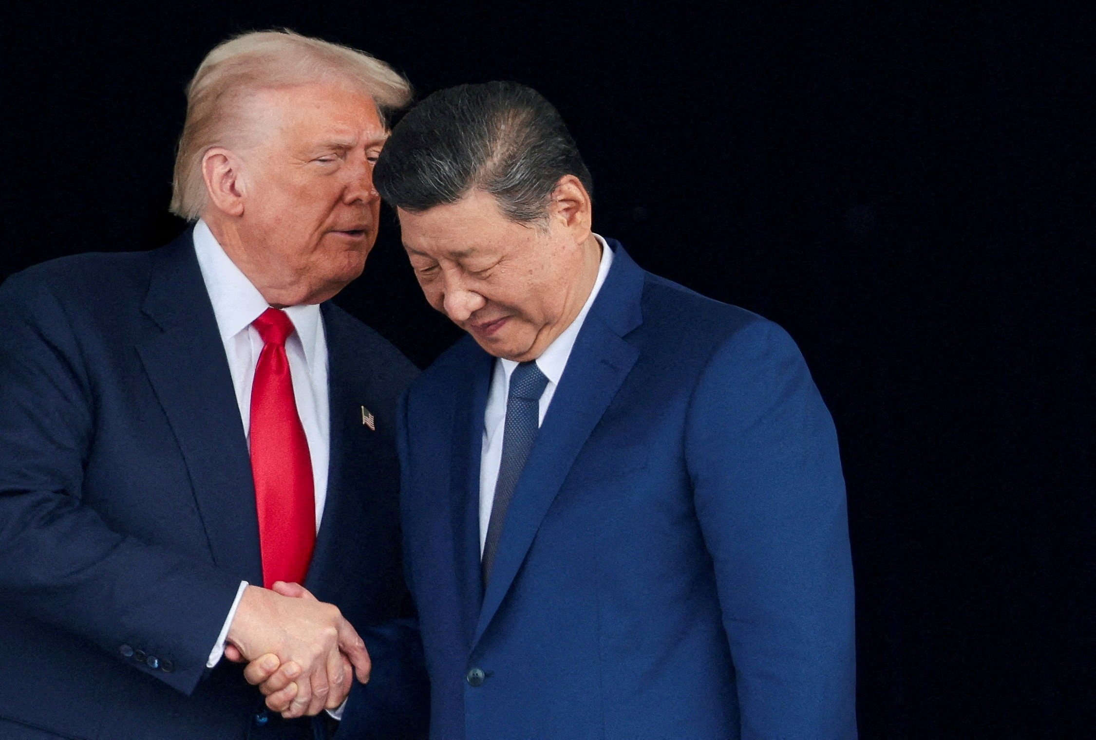 Three weeks Donald Trump and Xi Jinping were photographed smiling and shaking hands in South Korea, there is still no official deal between the two nations. Photo: Reuters