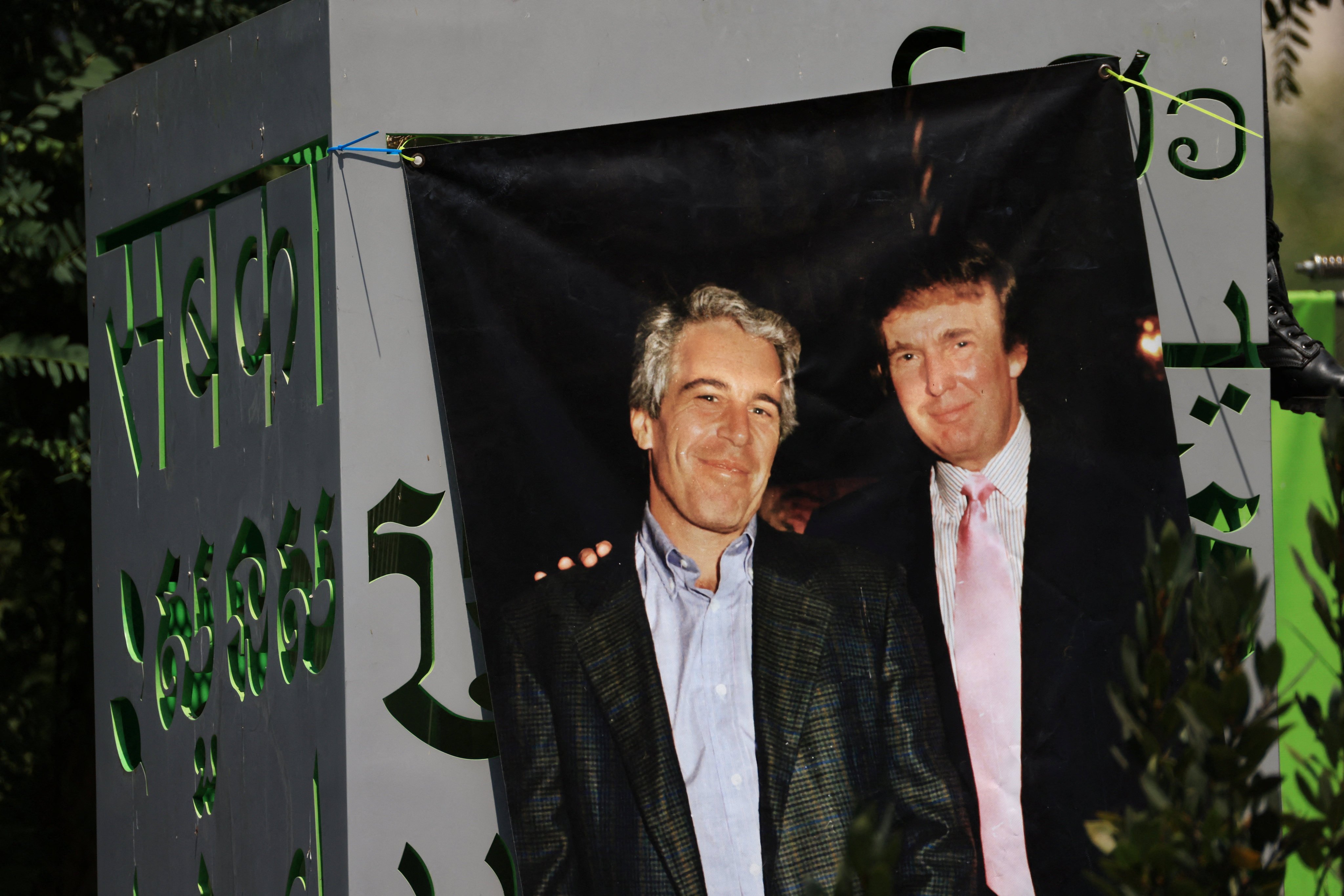 A banner of Jeffrey Epstein and US President Donald Trump (right) hangs in Grand Park during a protest in downtown Los Angeles, California in August. Photo: Reuters