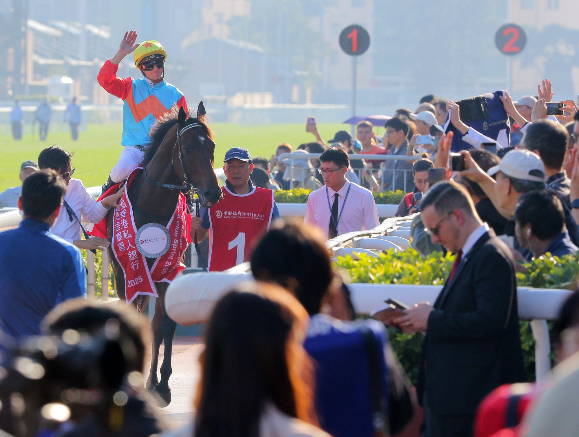 Zac Purton waves to fans after saluting aboard Ka Ying Rising at Sha Tin on Sunday.