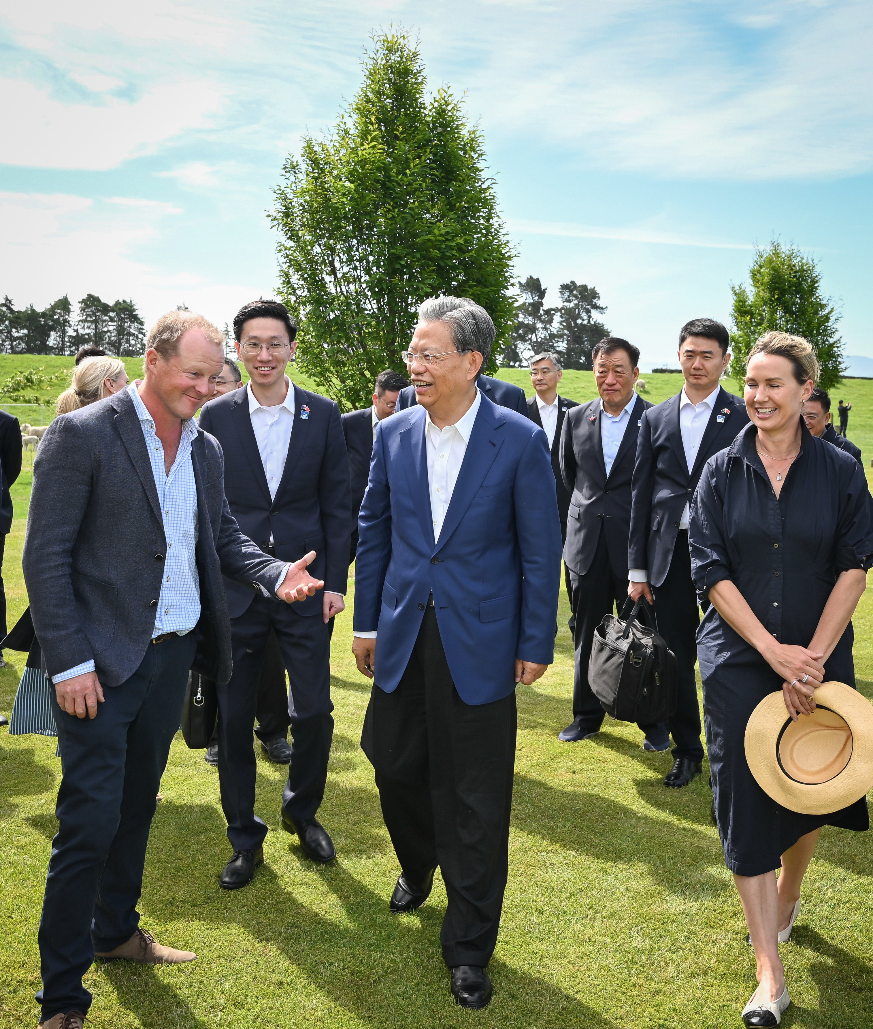 Zhao Leji (centre), chairman of China’s NPC Standing Committee, visits a local family at a farm in Christchurch, New Zealand, on November 21. Photo: Xinhua