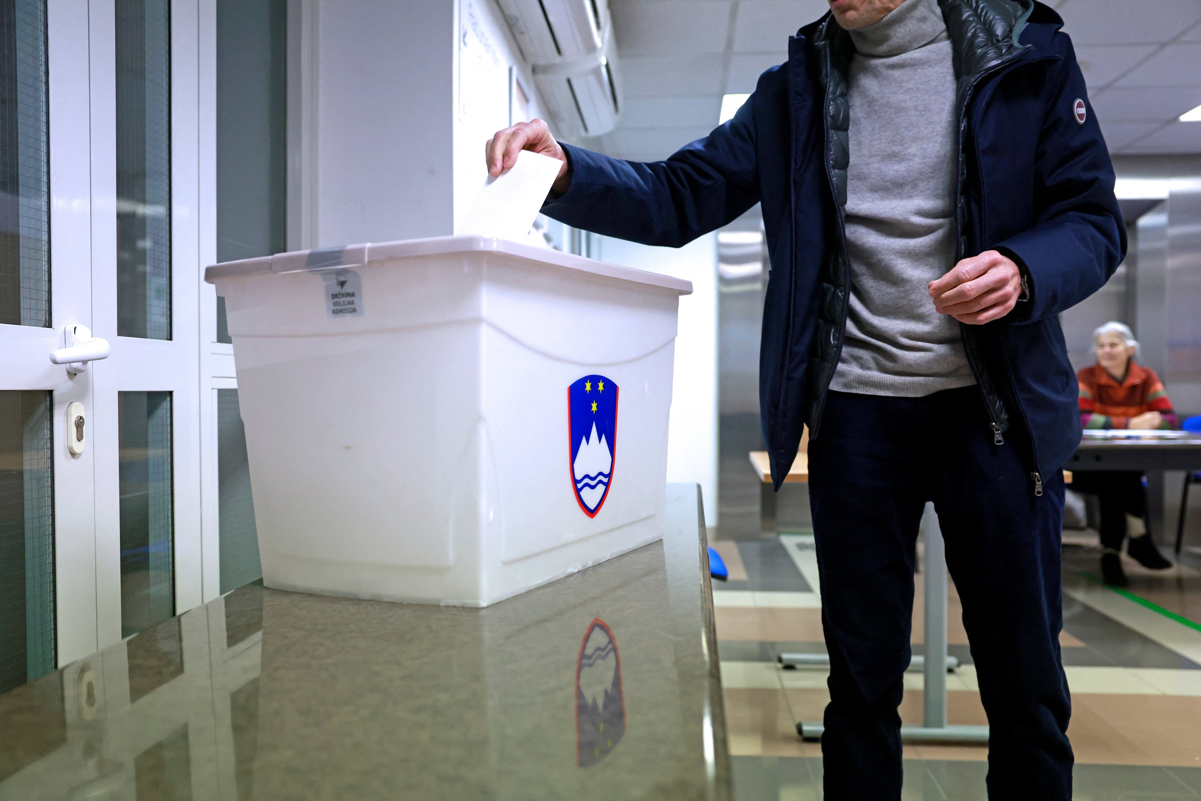 A person casts their ballot at a polling station in Ljubljana, Slovenia. Photo: Reuters