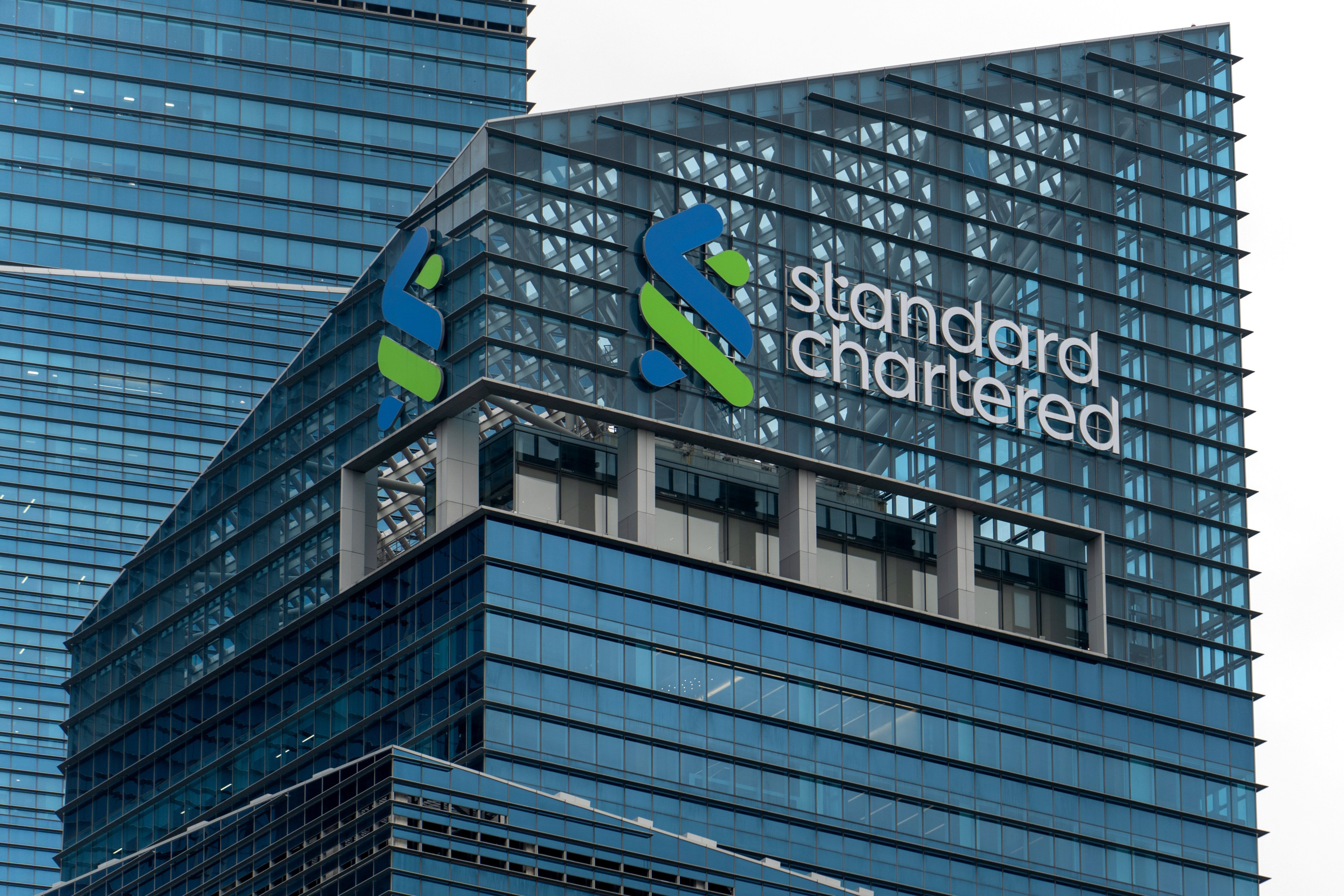 The Standard Chartered logo on tower one of the Marina Bay Financial Centre in Singapore. Photo: Harvey Kong