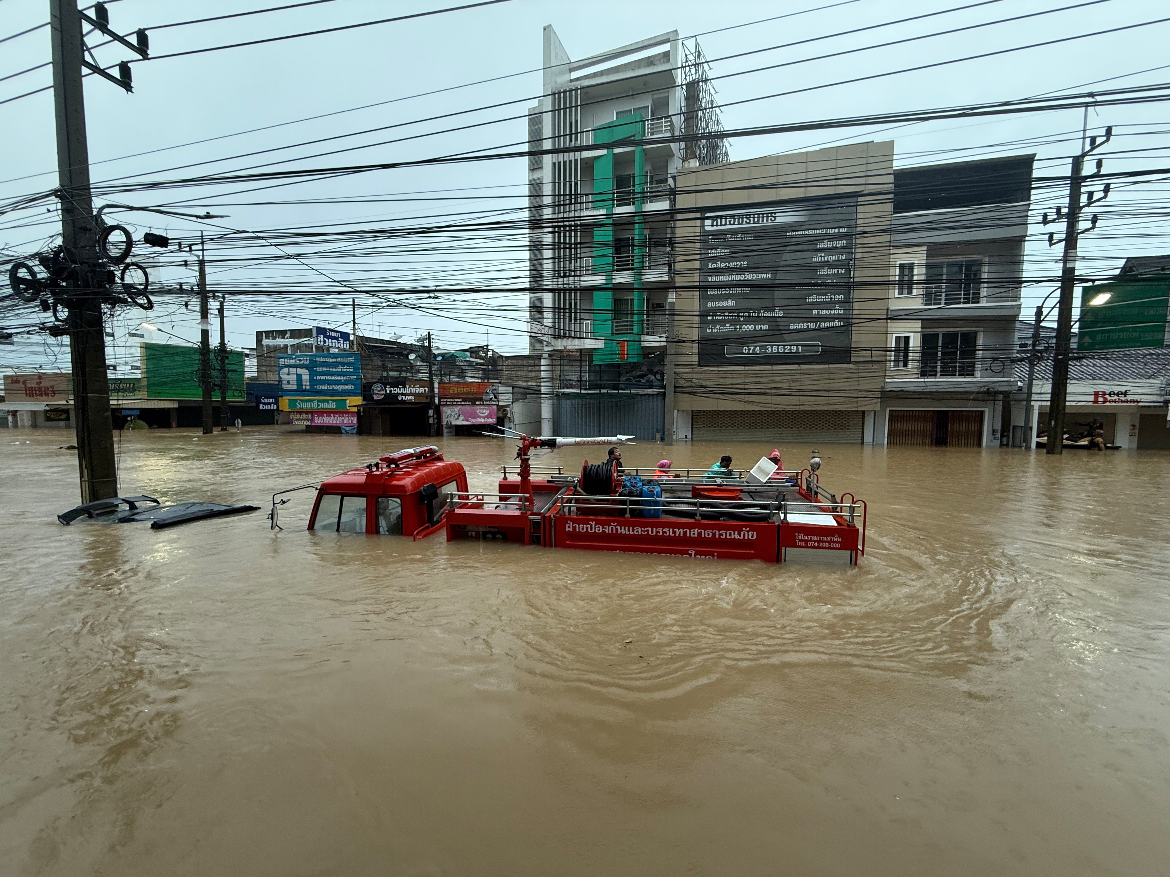 A fire truck is seen submerged in floodwaters in Songkhla province, southern Thailand, on Monday. The Cop30 summit set a goal of scaling up global climate finance to at least US$1.3 trillion per year by 2035. Photo: AP