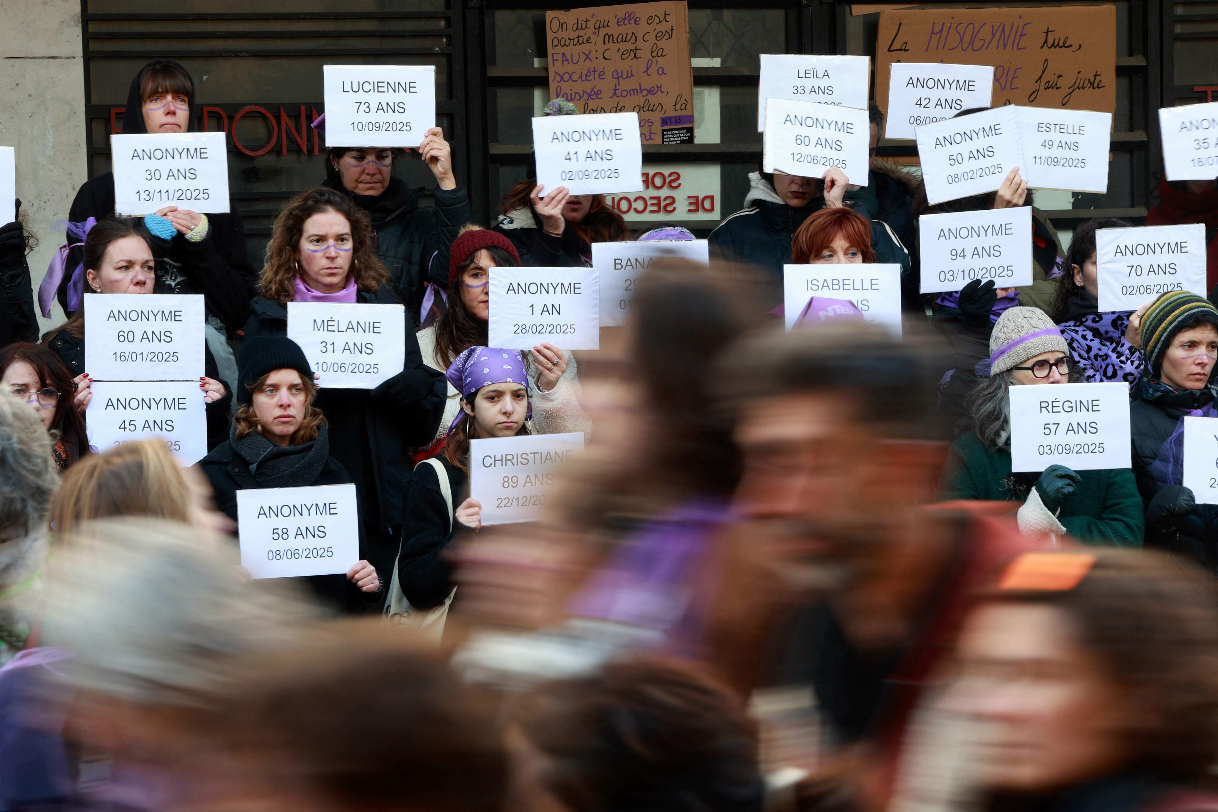Protesters display the names and ages of victims of femicide in Bordeaux, France on November 22, ahead of the International Day for the Elimination of Violence Against Women. Photo: AFP