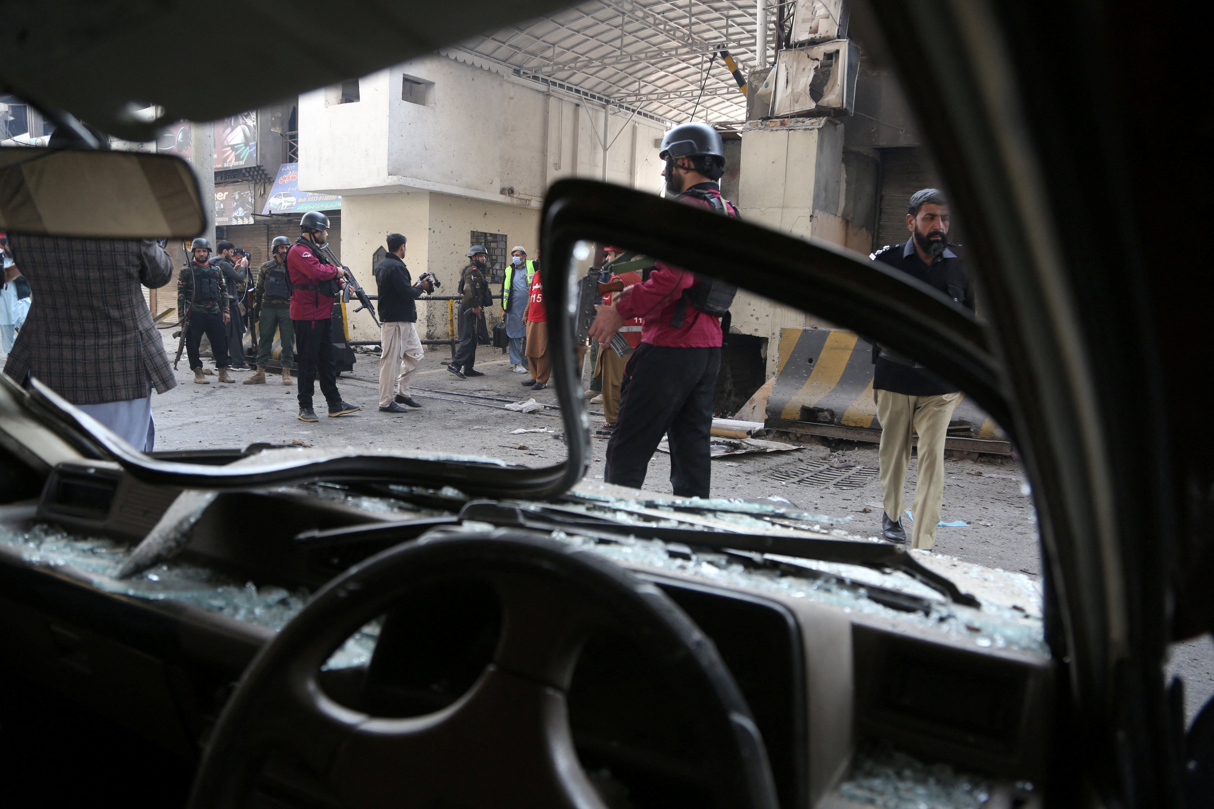 Paramilitary soldiers secured the entrance of their headquarters in Peshawar, Pakistan, on Monday after suicide bombers attacked it. Photo: Reuters