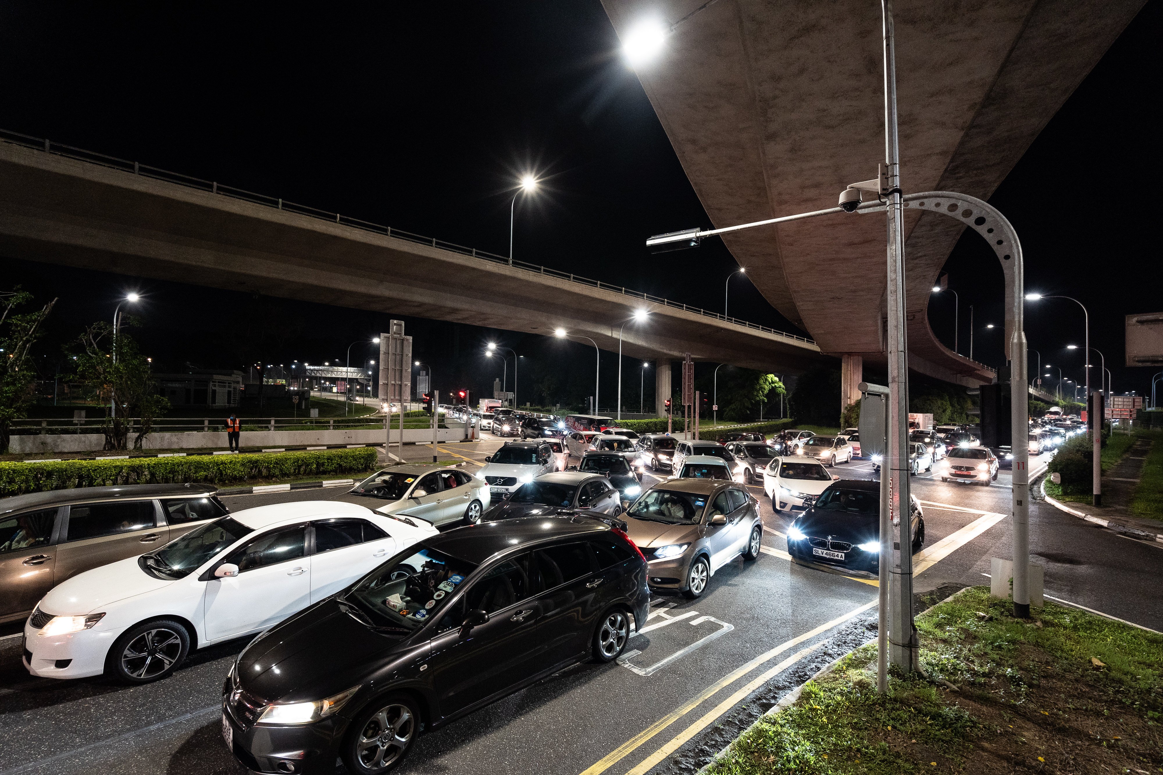 Cars queue up at Woodlands Checkpoint in Singapore. A Singapore private-hire driver has denied that a racist message on his car’s display system originated from him. Photo: Anadolu Agency via Getty Images
