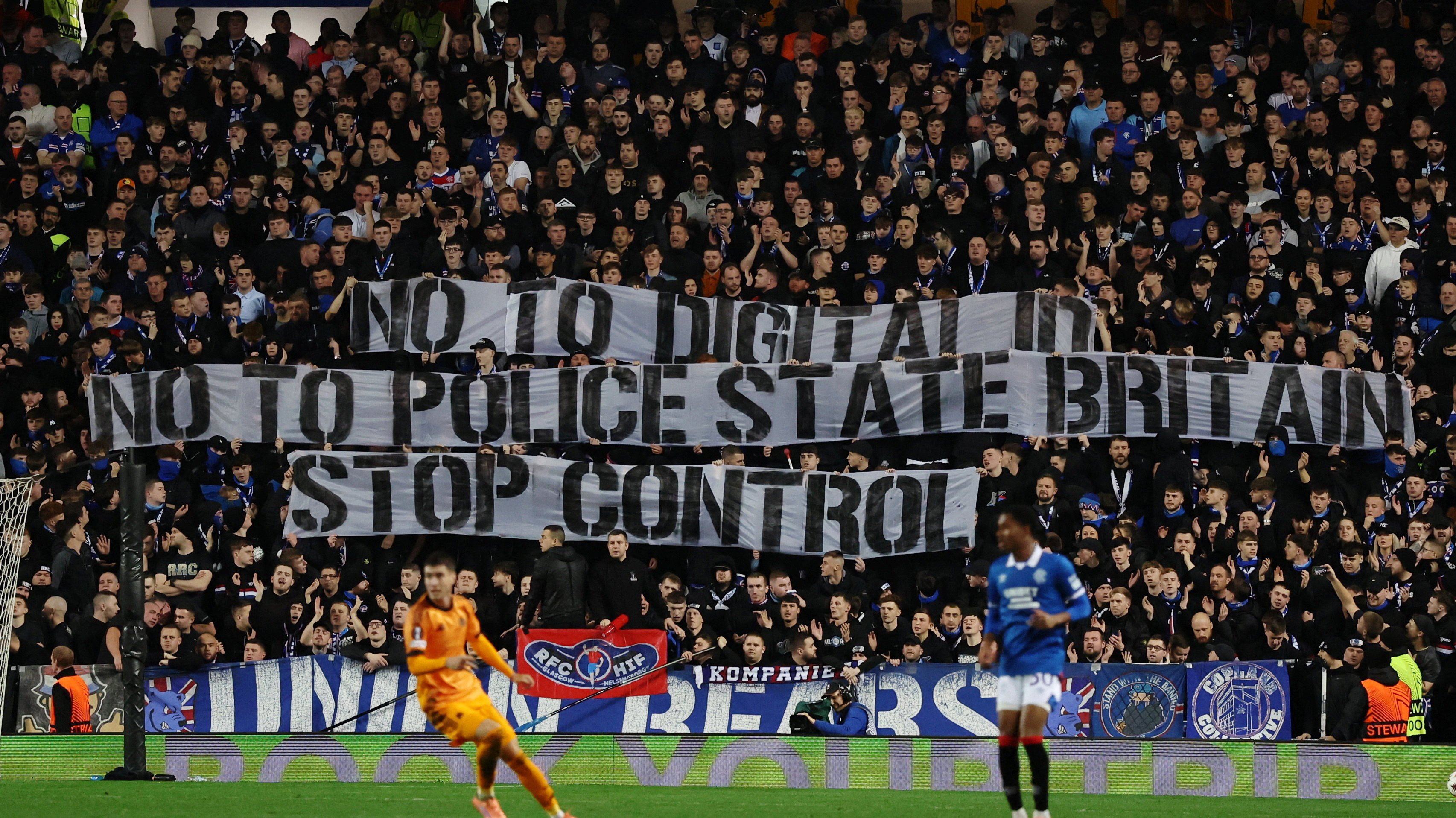 Football fans display banners against a digital ID - a plan that is highly controversial in the UK. Photo: Reuters