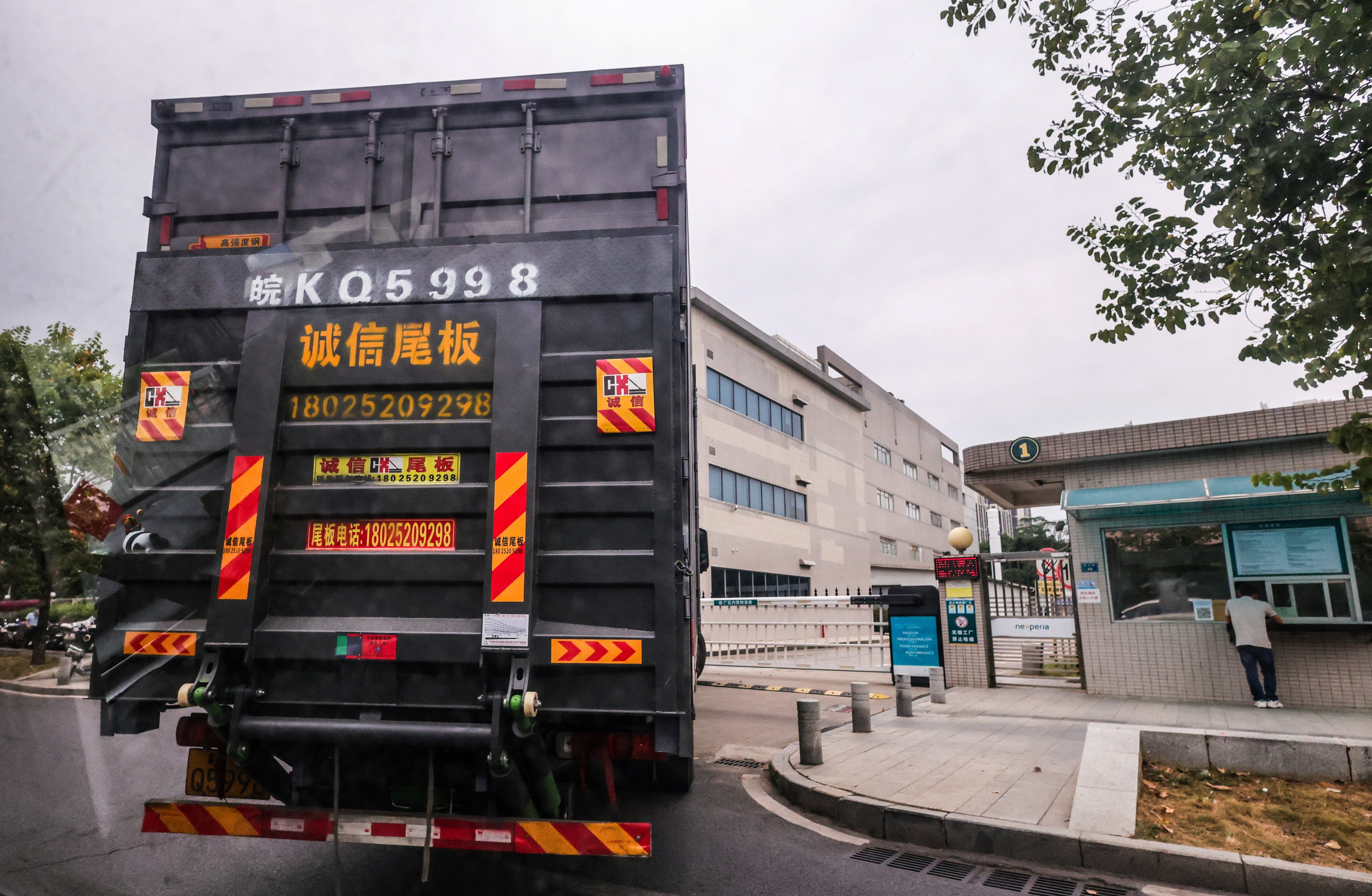 A truck waits outside the gate of Nexperia’s factory in Dongguan, Guangdong province on November 7. Photo: Reuters