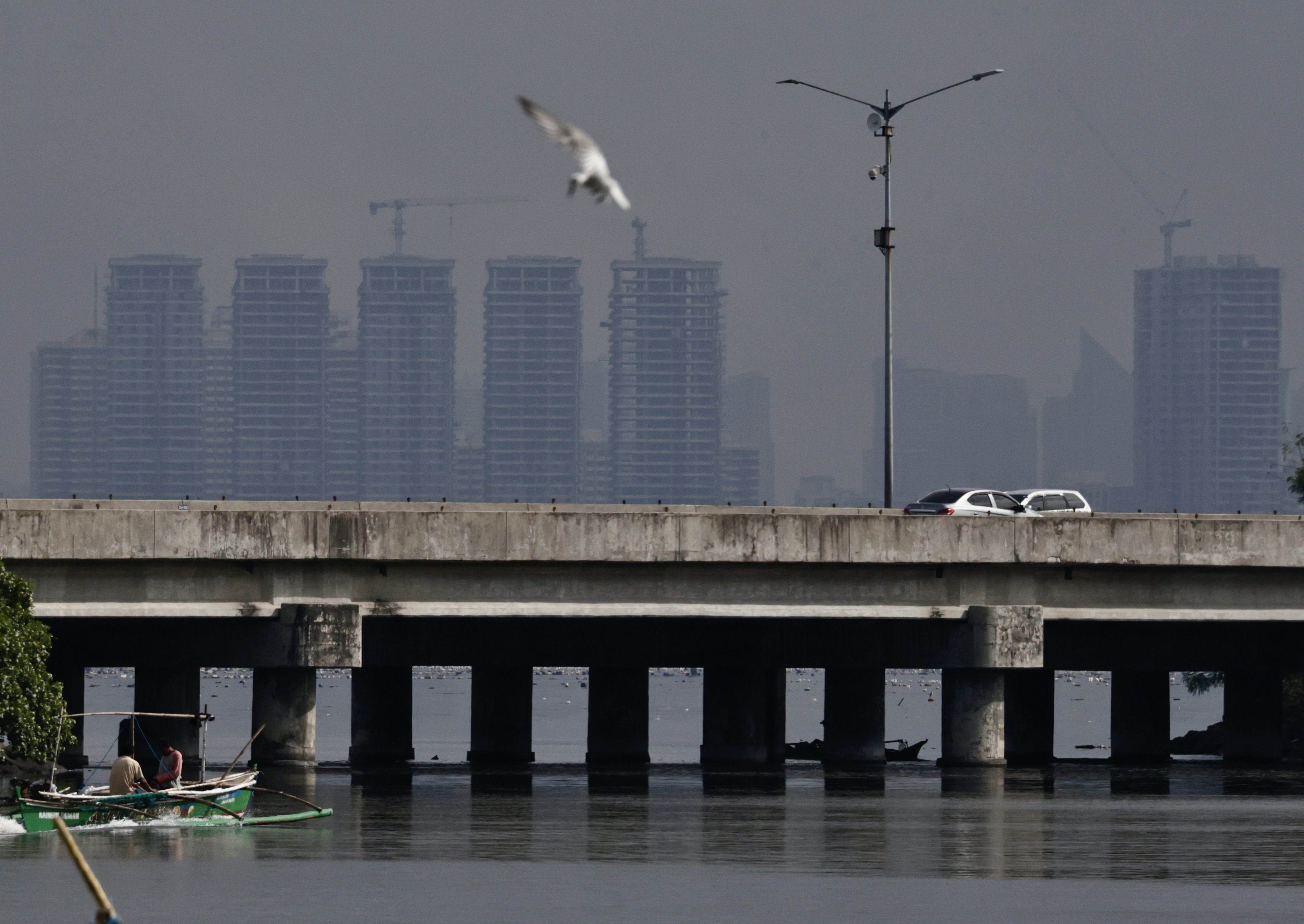 Manila’s skyline is seen from Bacoor City in Cavite province. Photo: EPA