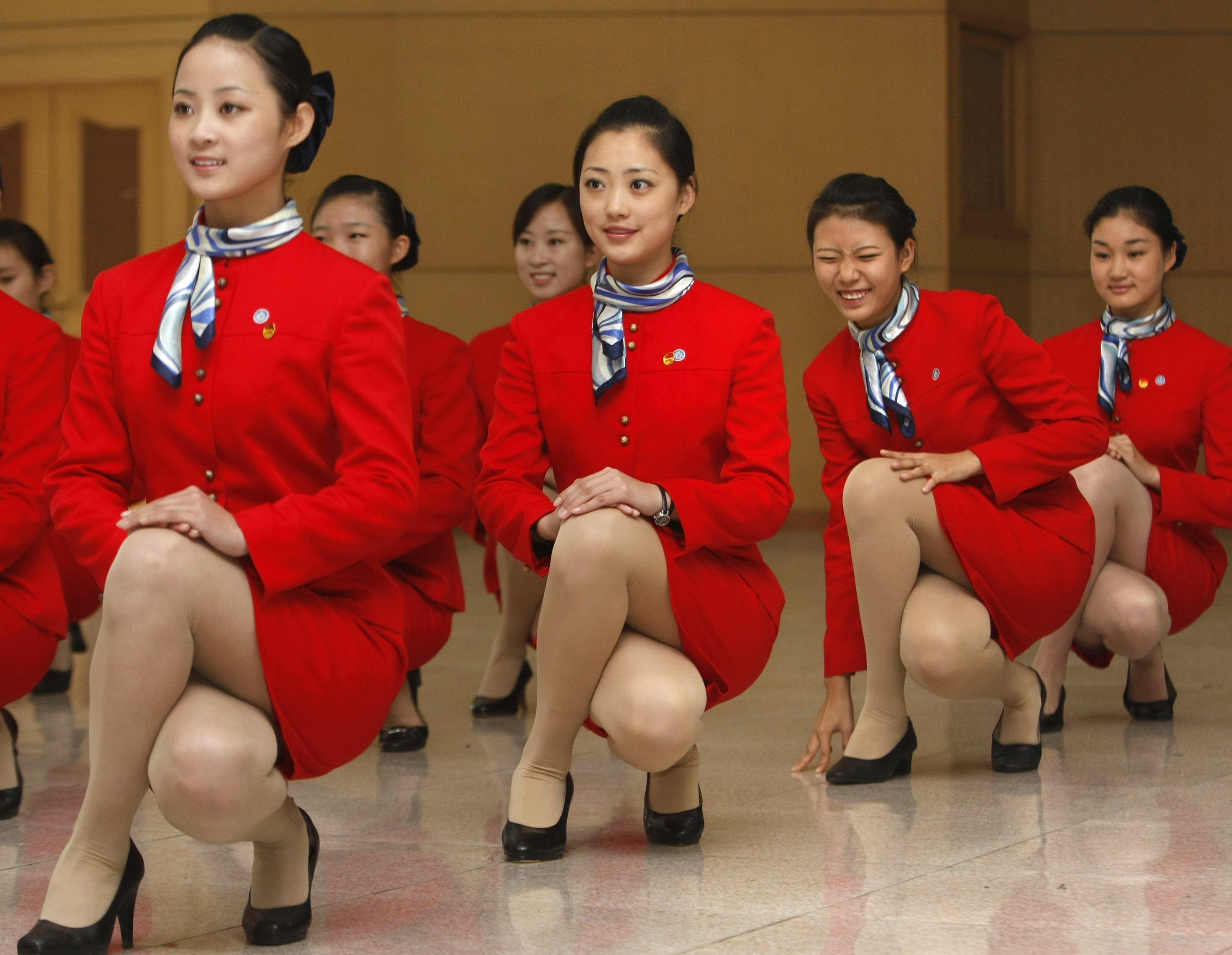Young women go through etiquette training at a vocational school in Beijing in 2007, ahead of the 2008 Olympics. Photo: Reuters