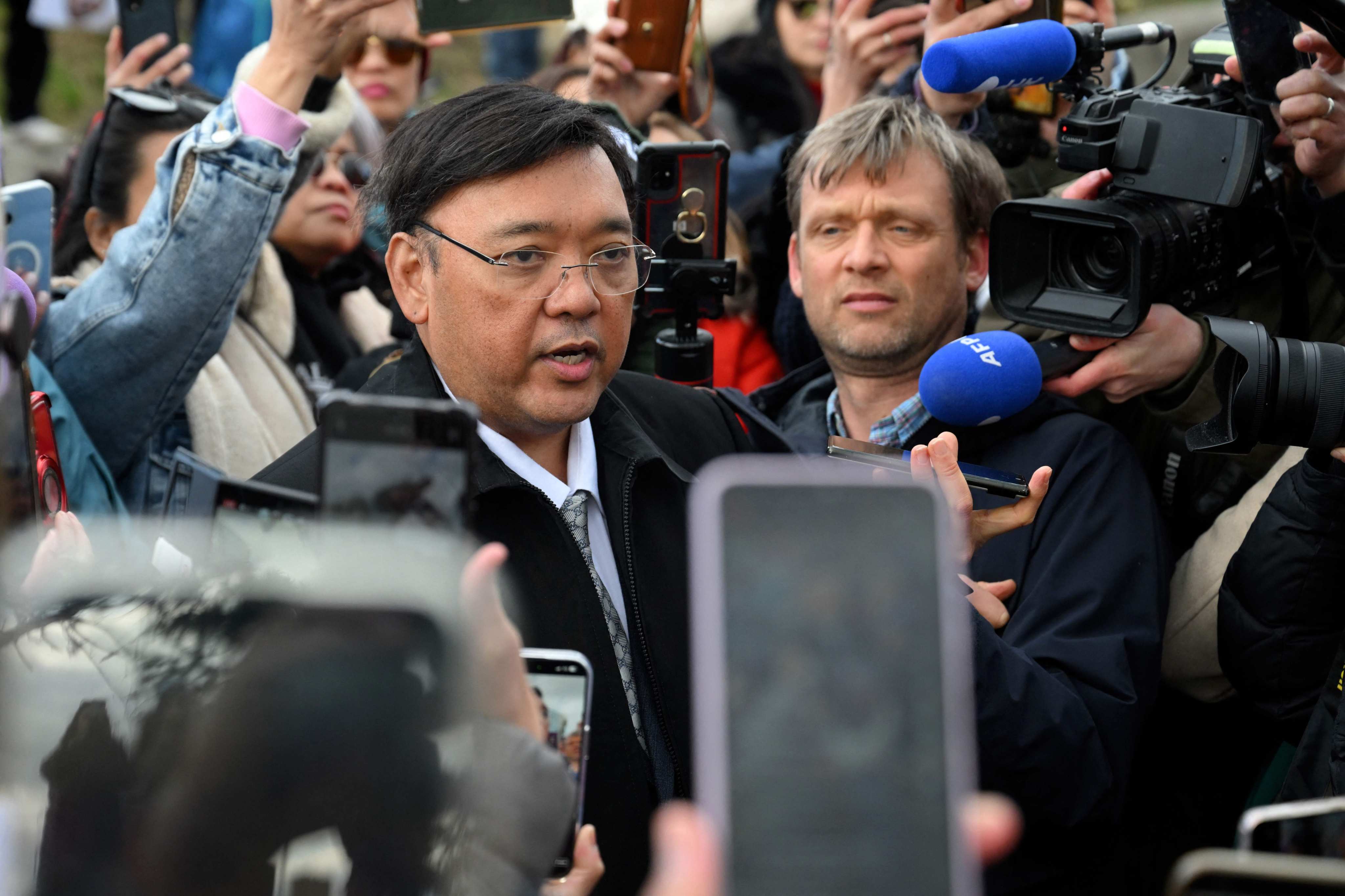 Harry Roque, a spokesman for ex-Philippine president Rodrigo Duterte, talks to journalists outside the International Criminal Court ahead of Duterte’s hearing in The Hague in March. Photo: AFP