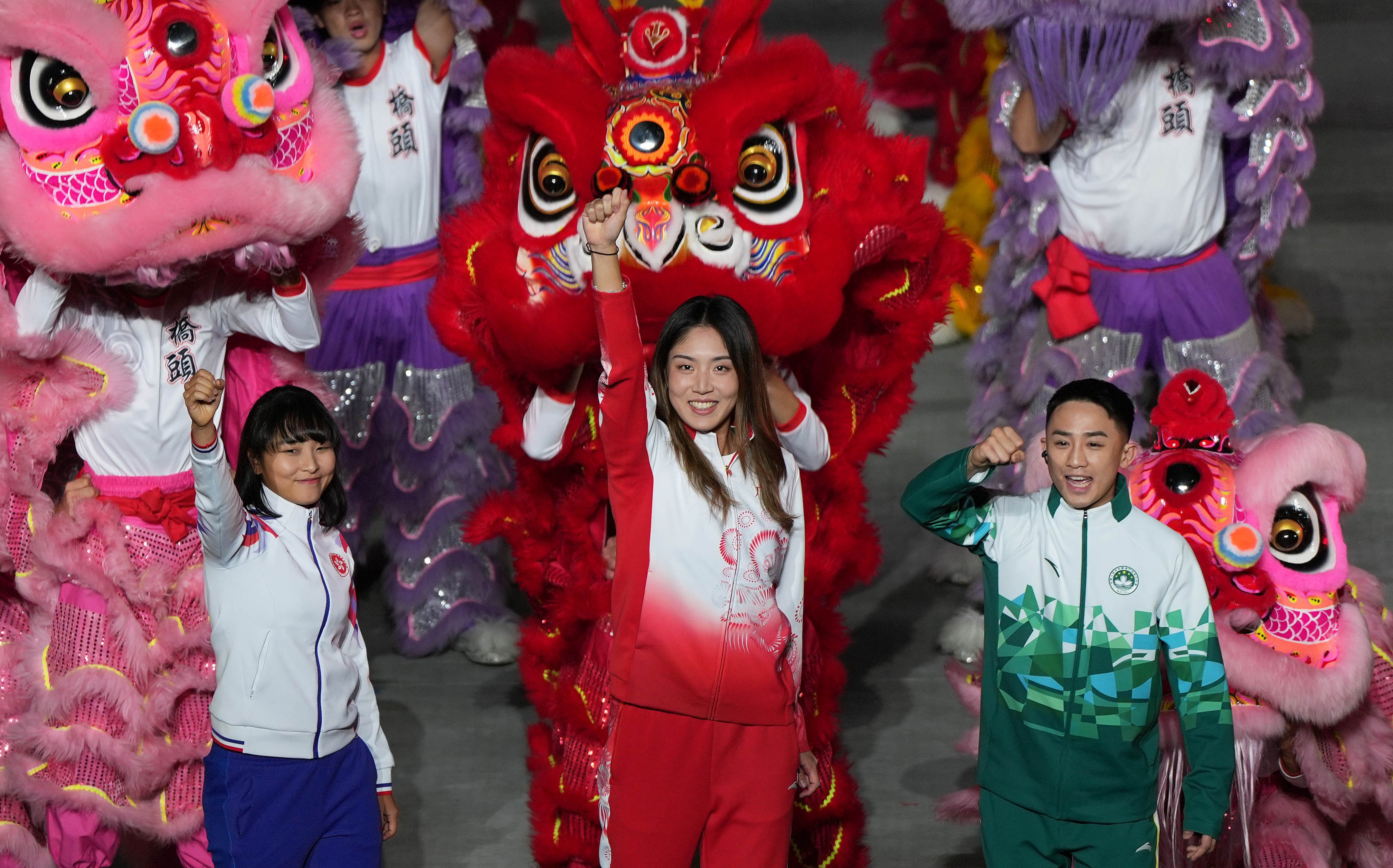 From the left, Hong Kong’s Ceci Lee Sze-wing, Guangdong’s Wang Xinyu and Macau’s Kuok Kin Hang celebrate at the closing ceremony of China’s 15th National Games, in Shenzhen on November 21. Photo: Xinhua