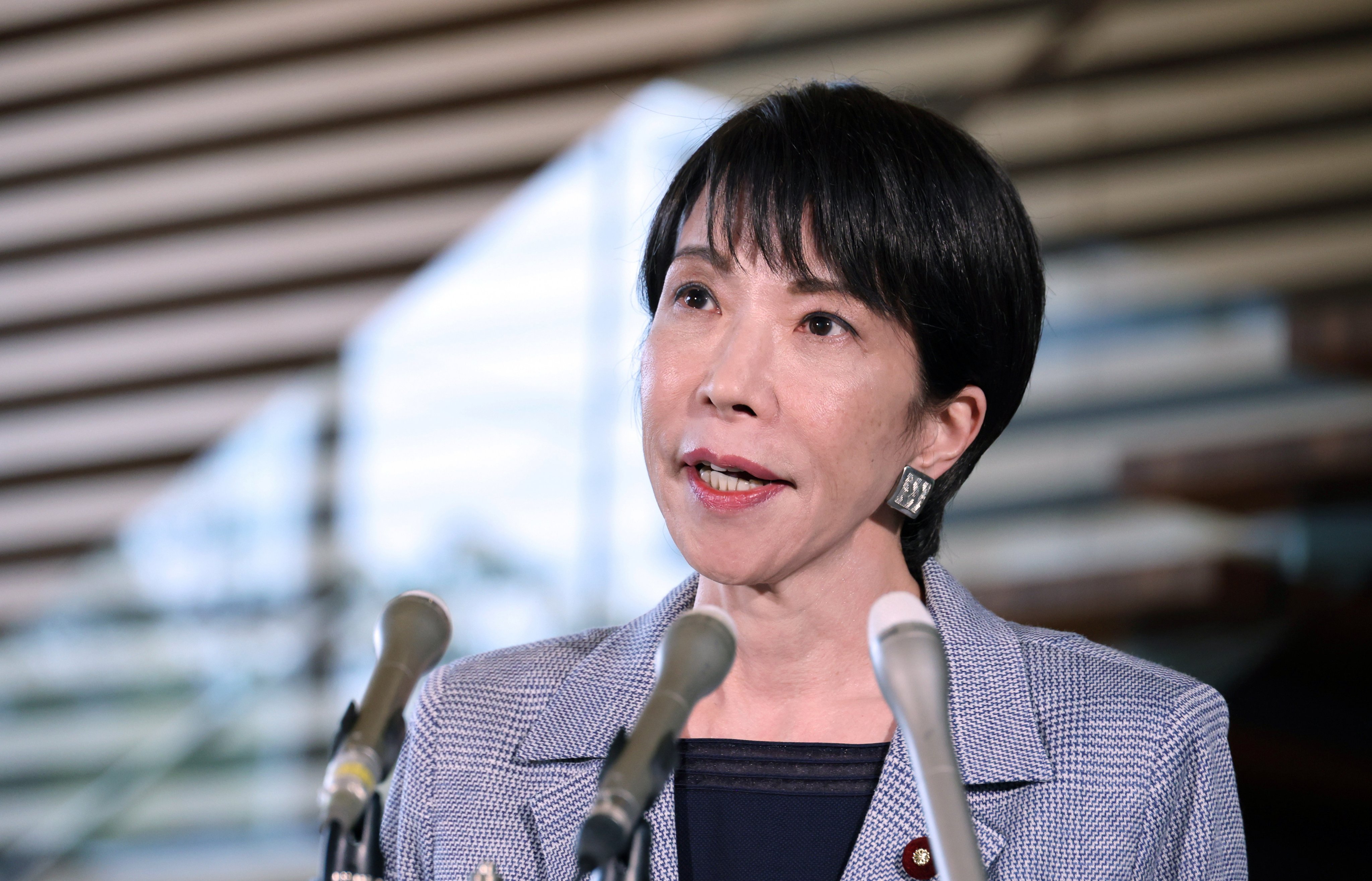Japanese Prime Minister Sanae Takaichi speaks to reporters after her phone call with US President Donald Trump, where he reportedly urged her not to provoke Beijing. Photo: EPA