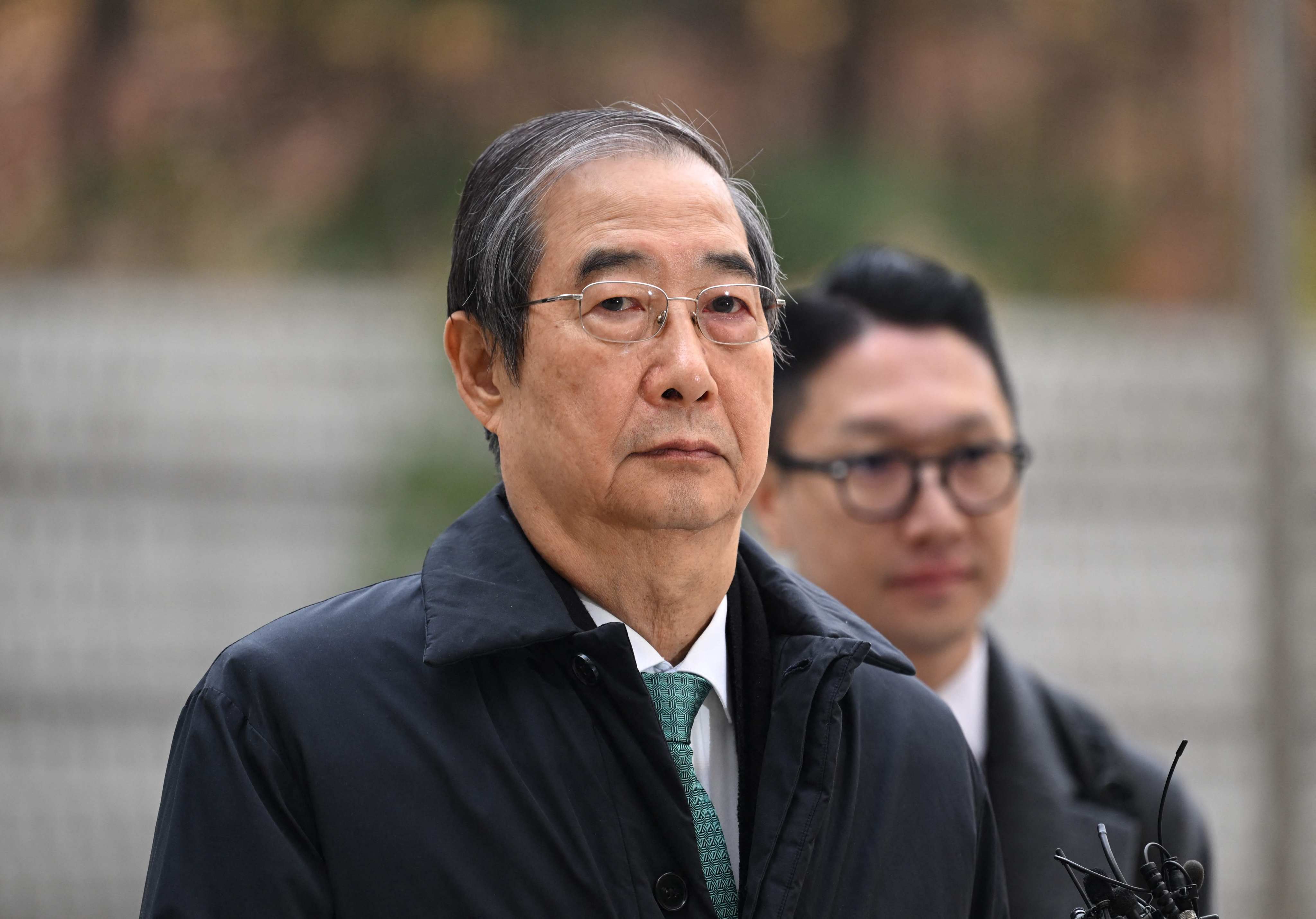Former South Korean prime minister Han Duck-soo arrives at court for his final hearing on insurrection charges on Wednesday. Photo: AFP