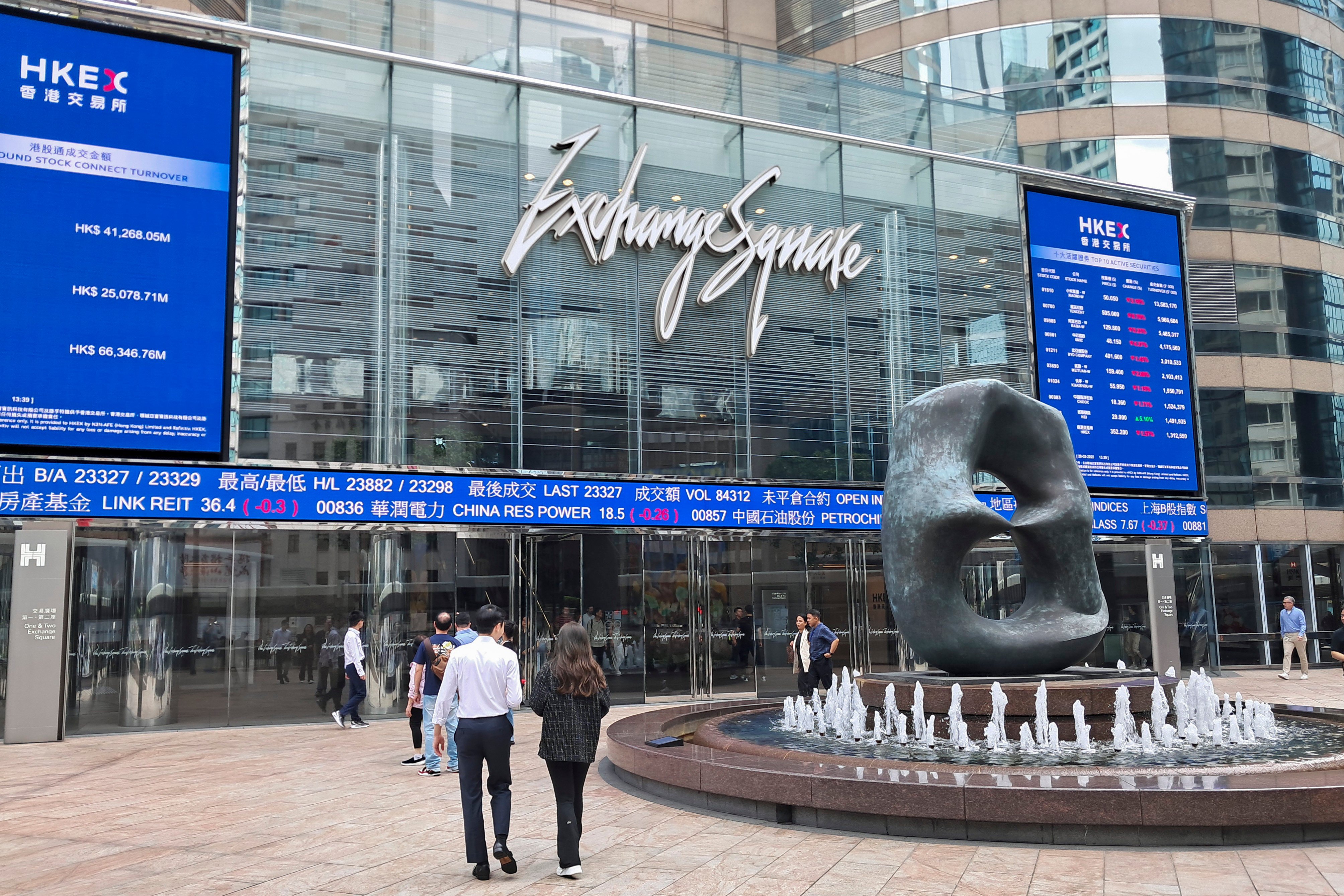 People walk past Exchange Square in Central, home of Hong Kong’s bourse operator Hong Kong Exchanges and Clearing, on March 28, 2025. Photo: Matthew Miller